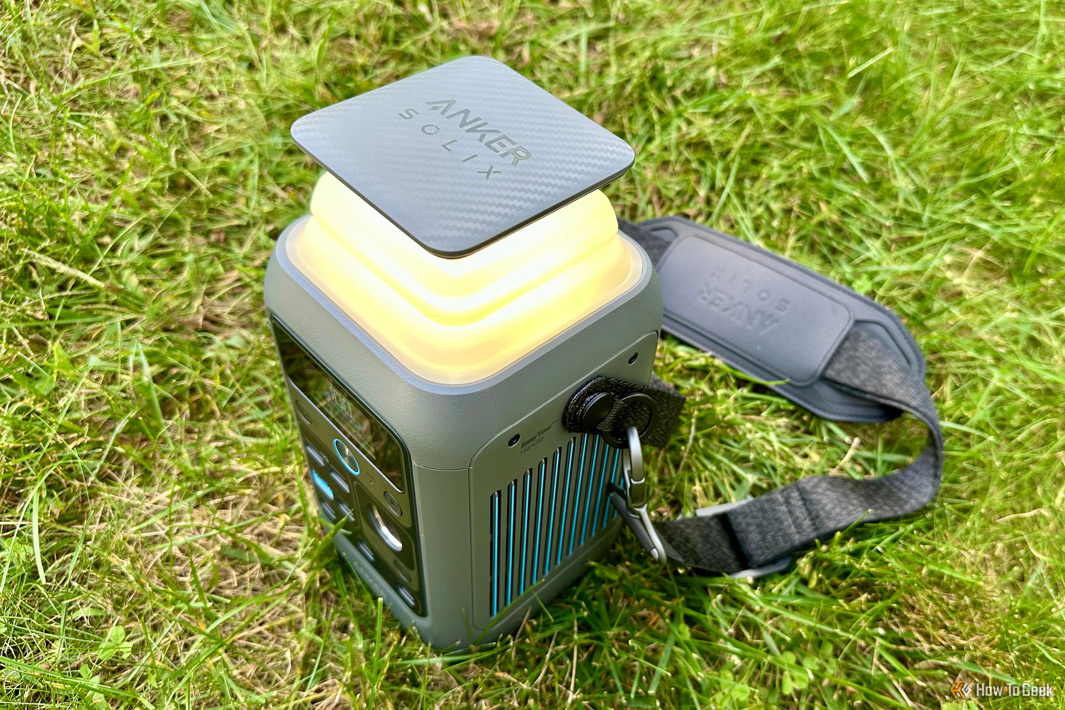 Anker SOLIX C300 DC with light on sitting on the grass