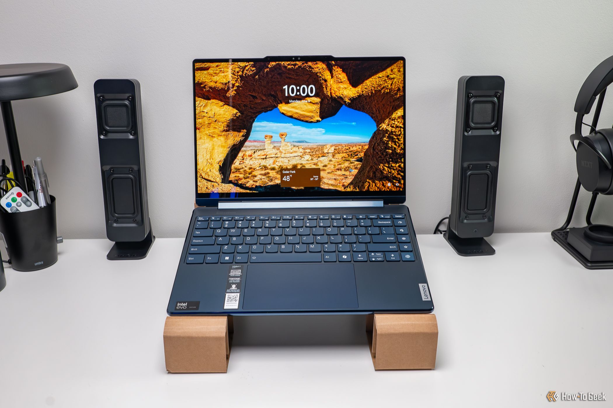 The Lenovo Yoga 9i 2-in-1 Gen 9 on the included cardboard as a laptop stand