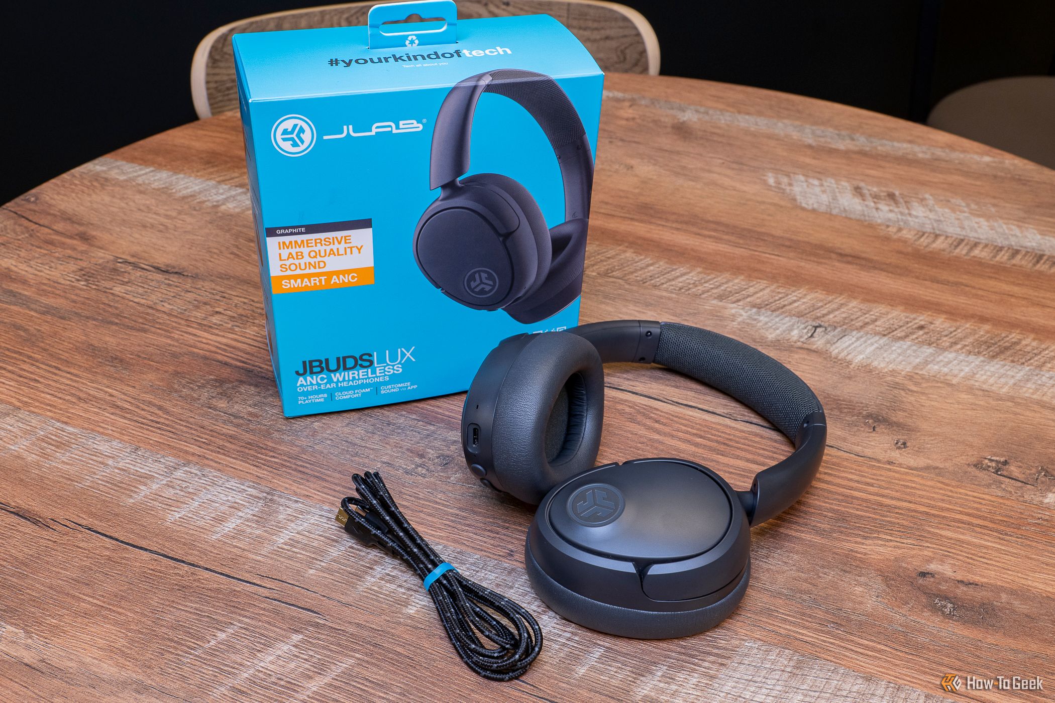 The JLab JBuds Lux ANC Wireless Headphones with charging cable and box