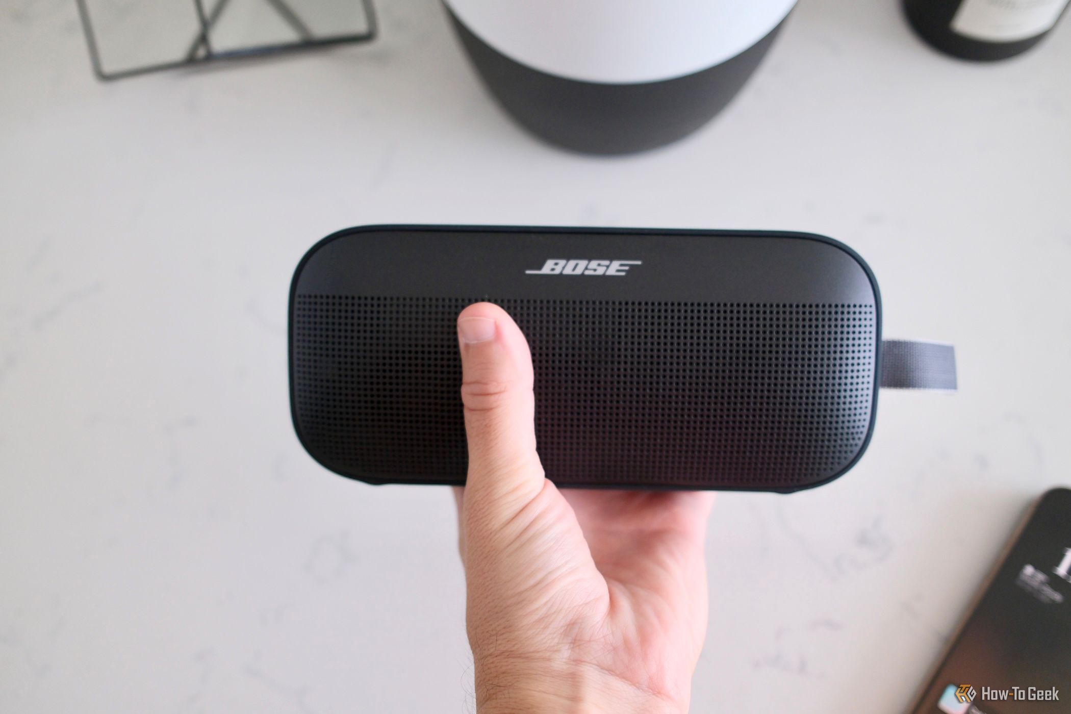 Bose SoundLink Flex (2nd Gen) being held in a hand