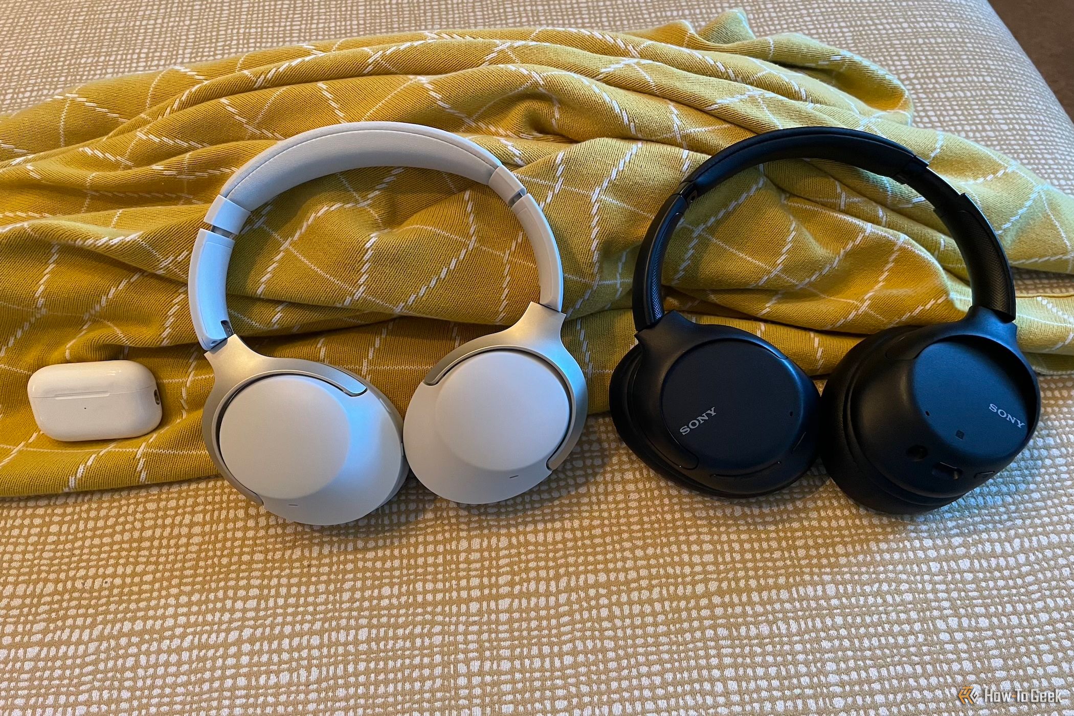 The Creative Zen Hybrid SXFI headphones next to the Apple AirPods Pro 2 (left) and Sony WH-CH710N ANC headphones (right)