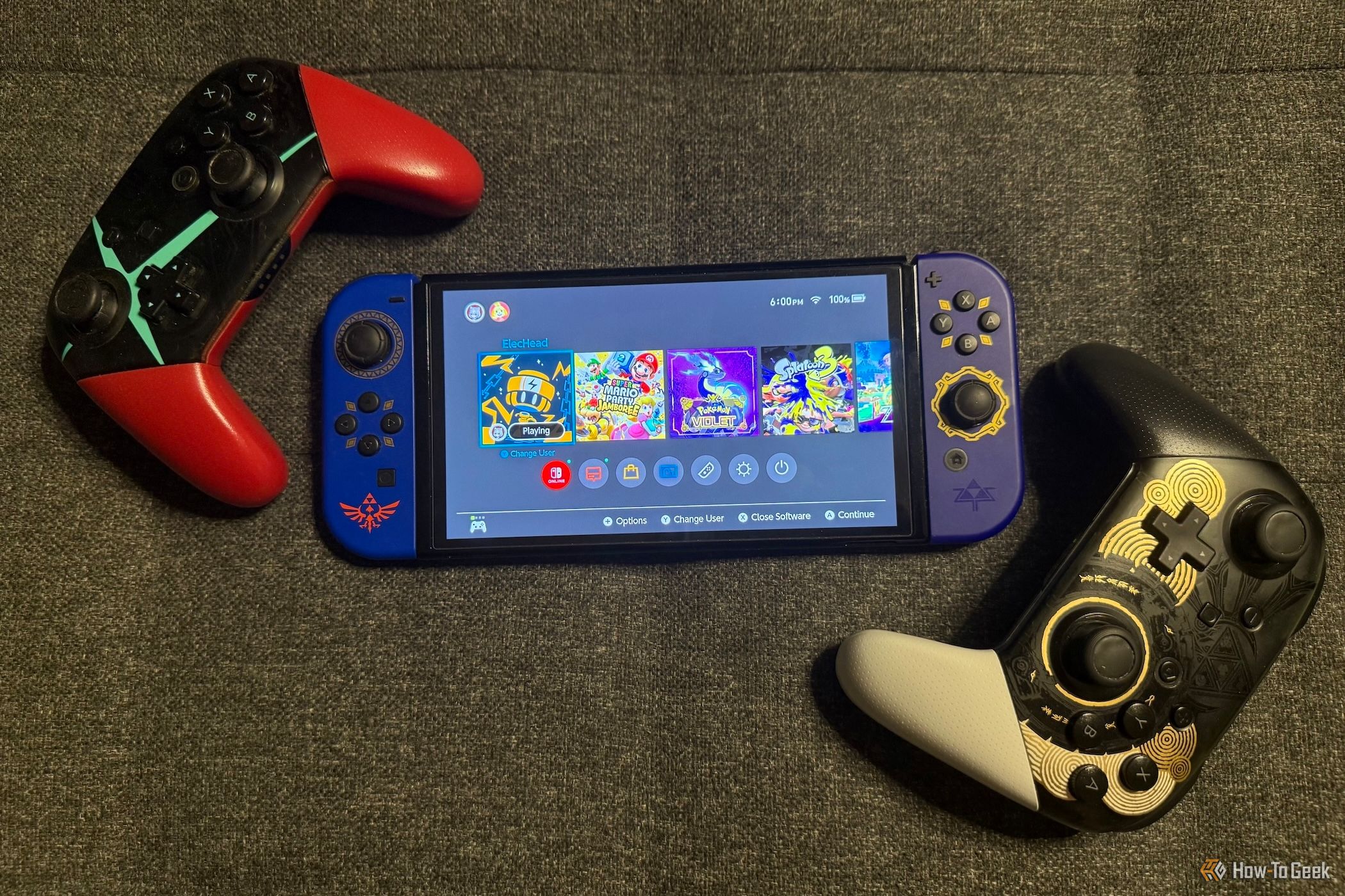 Nintendo Switch OLED with Zelda Joy-Cons, a Xenoblade controller, and a Zelda controller.