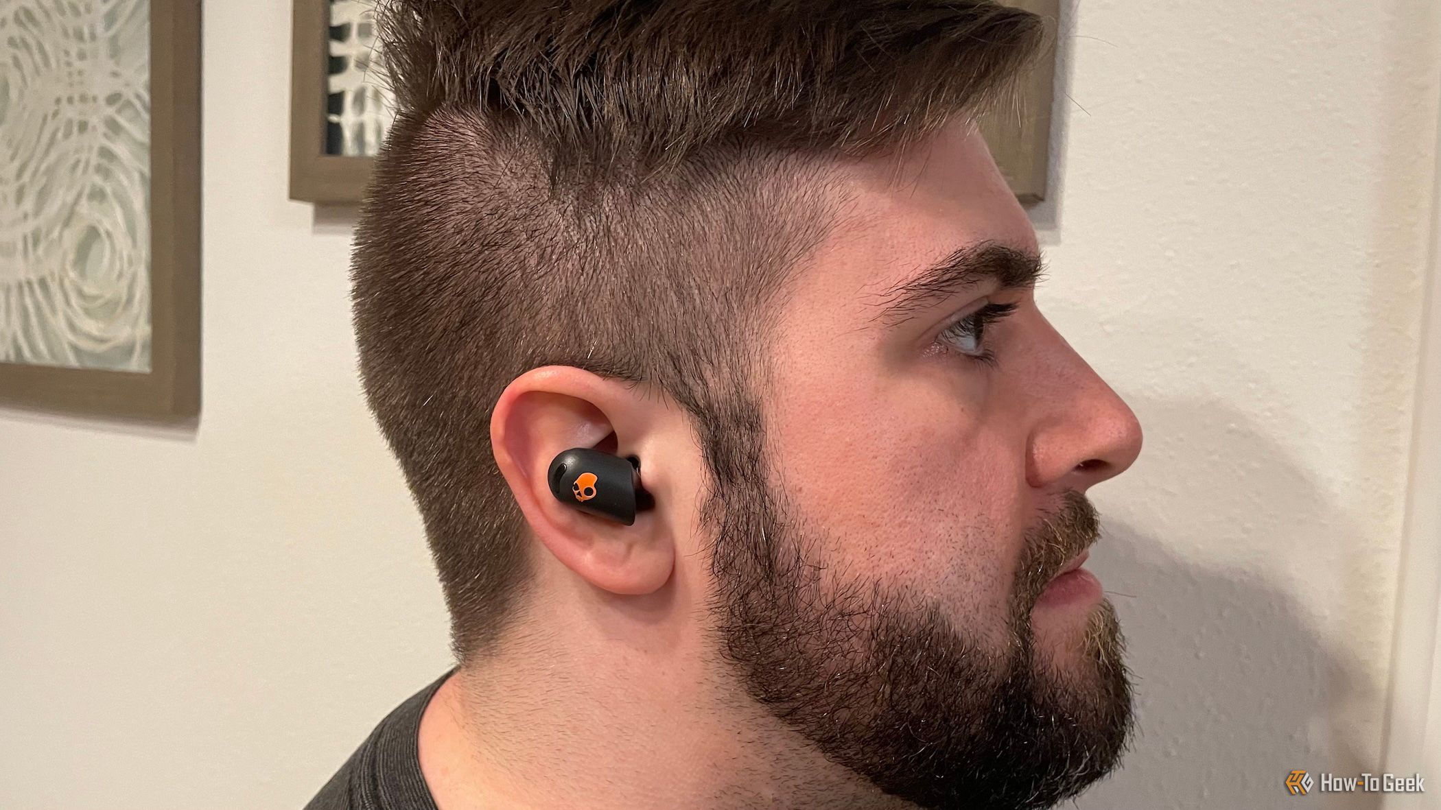 A person wearing a Skullcandy Sesh ANC Active earbud