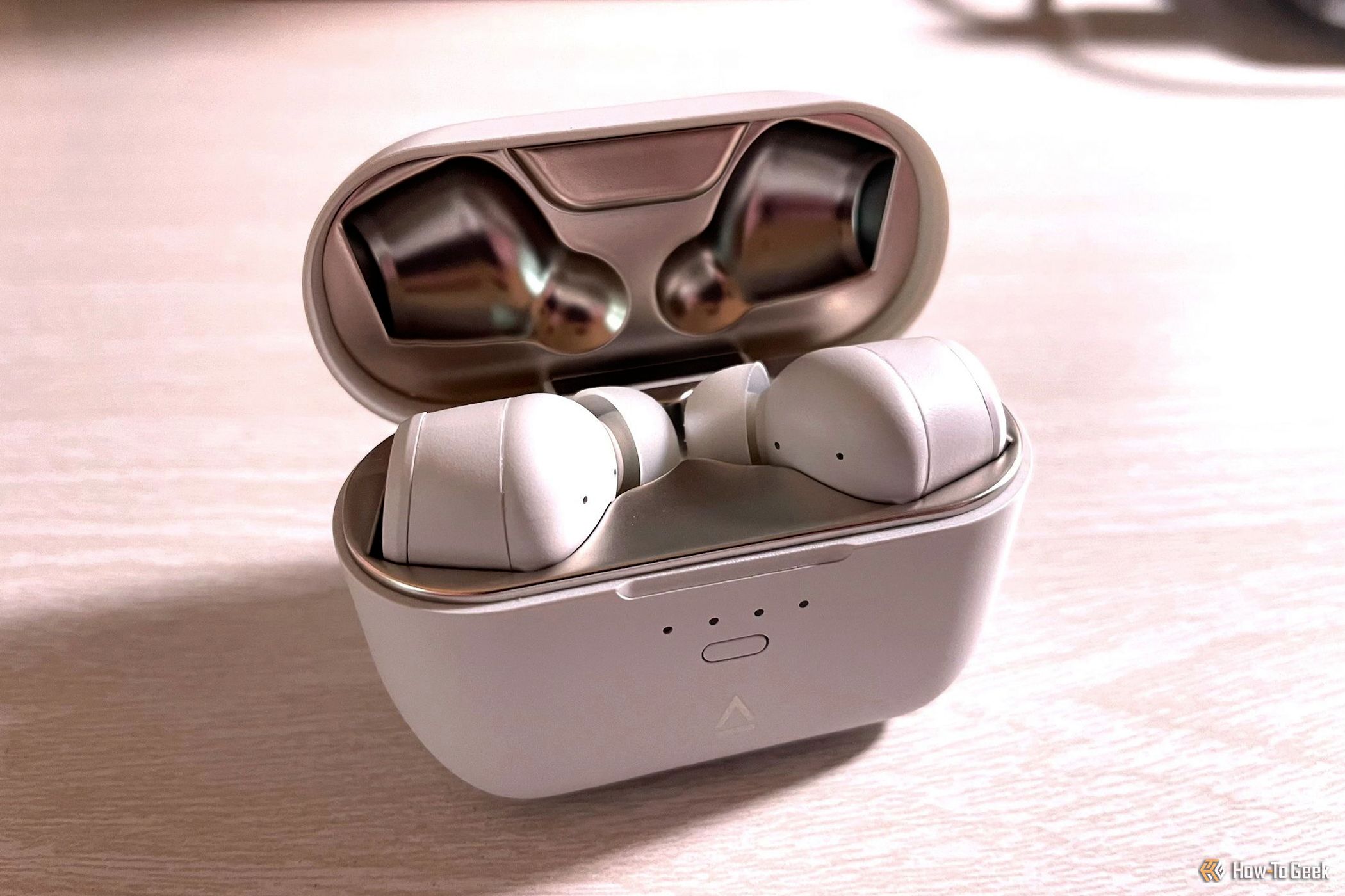 The Creative Zen Air SXFI earbuds in their charging case.