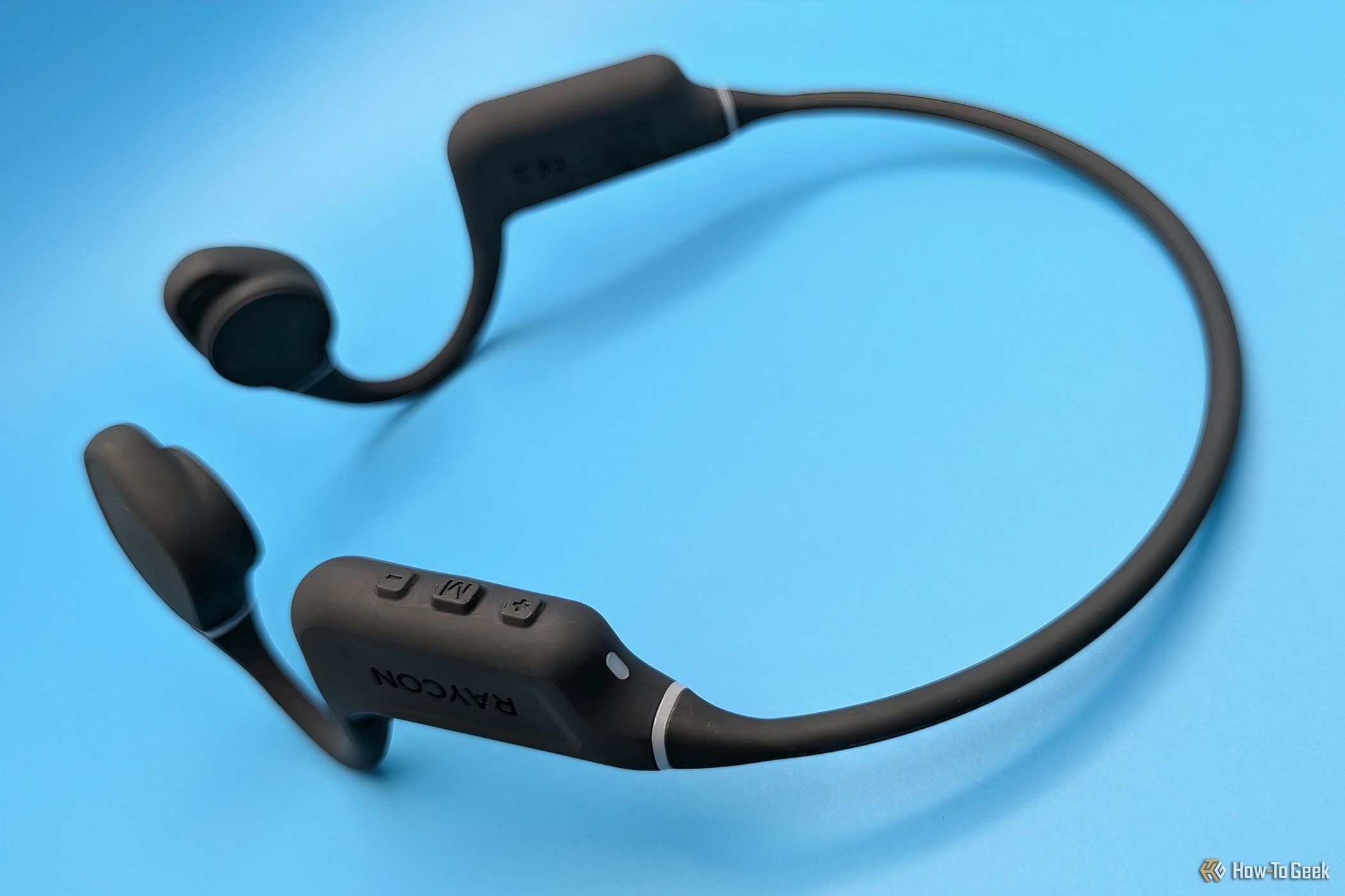 A view of the Raycon Bone Conduction Headphones with the buttons side up