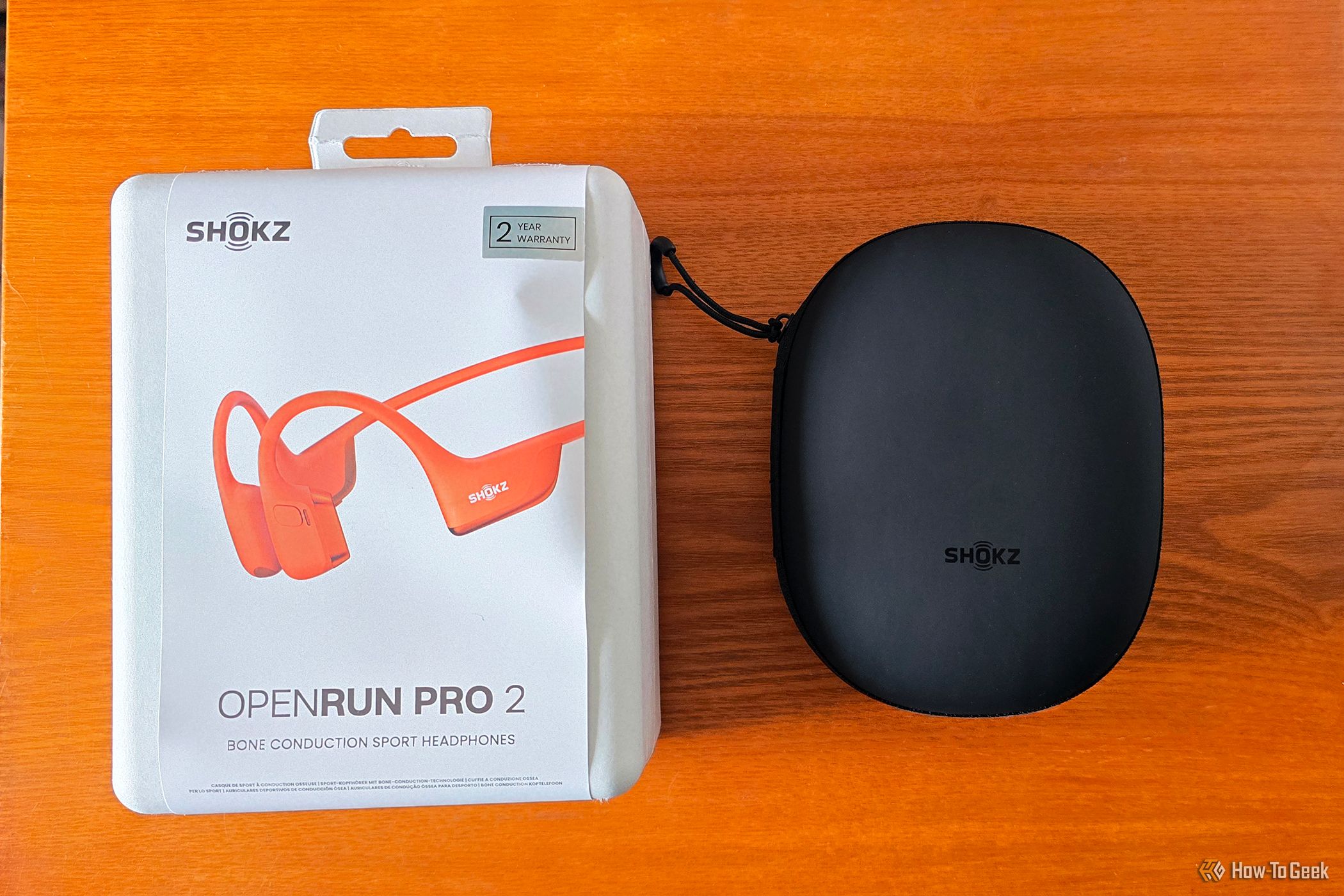 The Shokz OpenRun Pro 2 headphones with the case and box