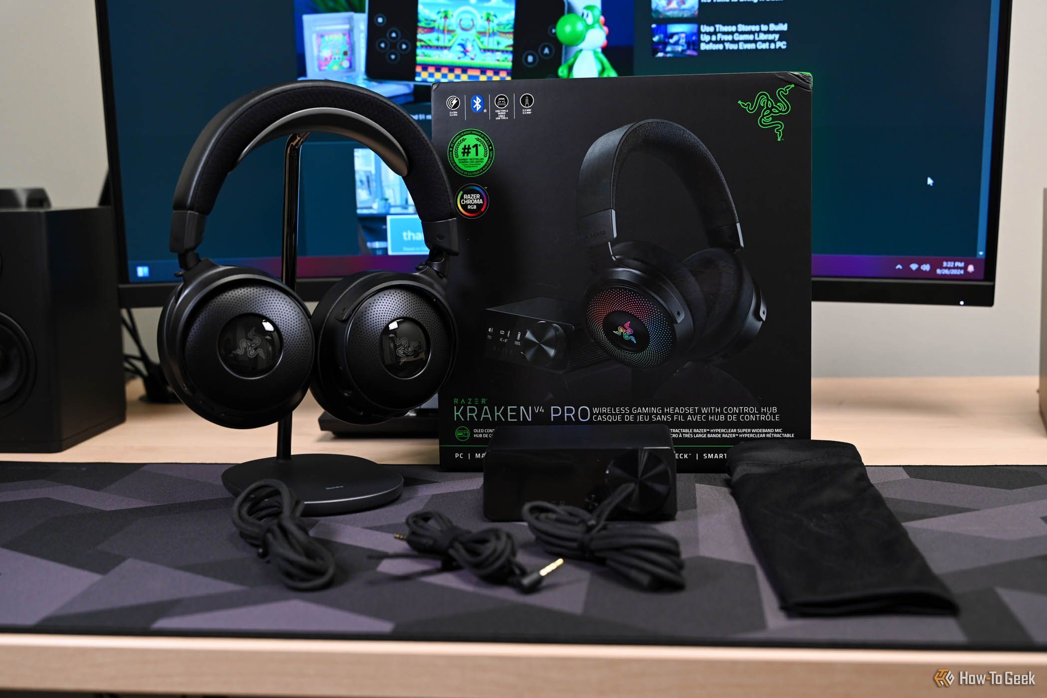 Razer Kraken V4 Pro on a headset stand with package contents