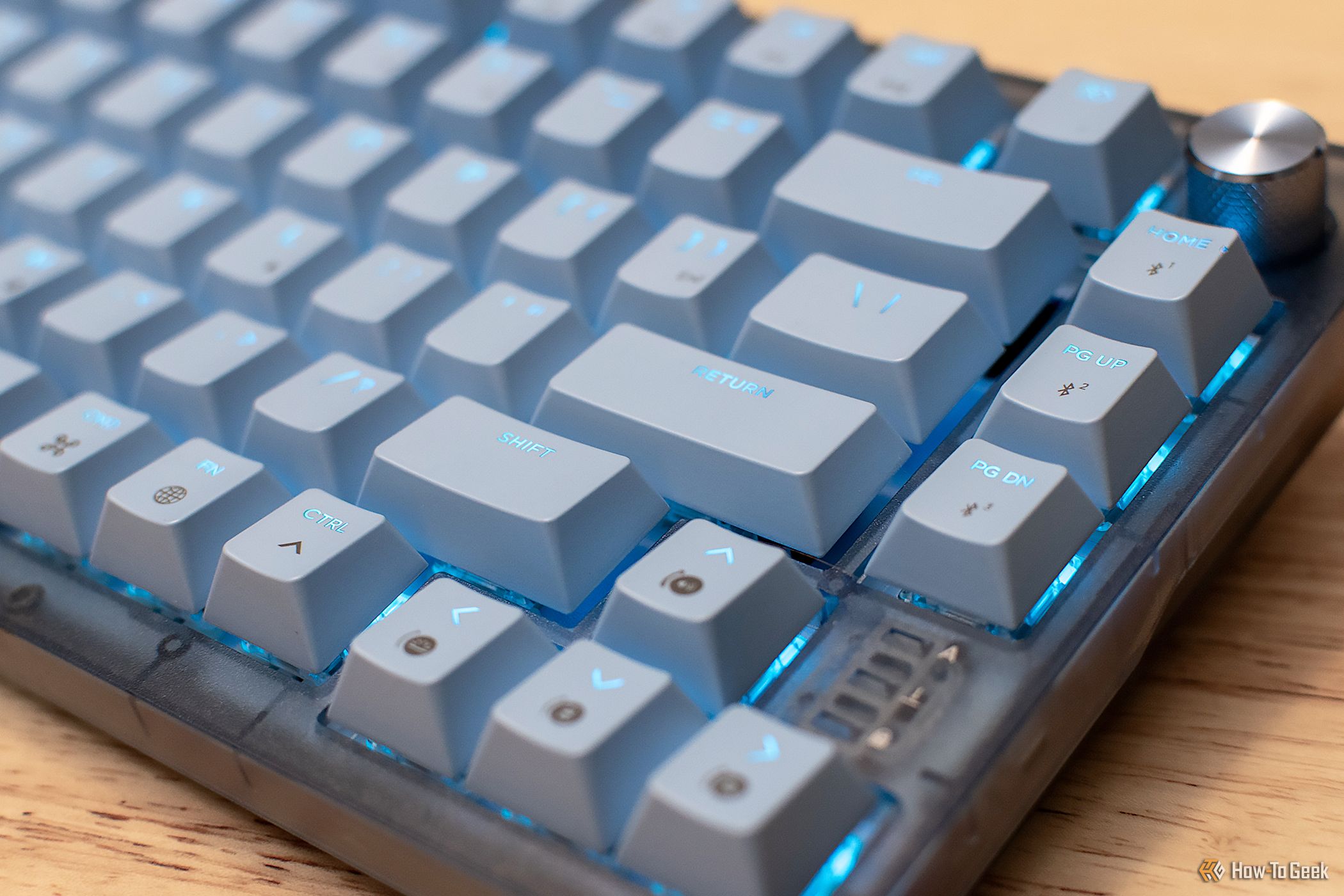 Corsair K65 Apple Edition mechanical Mac keyboard with blue RGB backlighting.