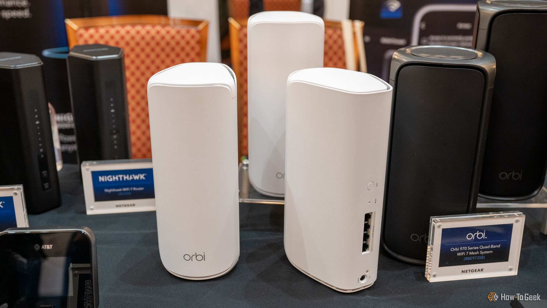 NETGEAR Orbi 870 Series Mesh Wi-Fi System sitting on a table.