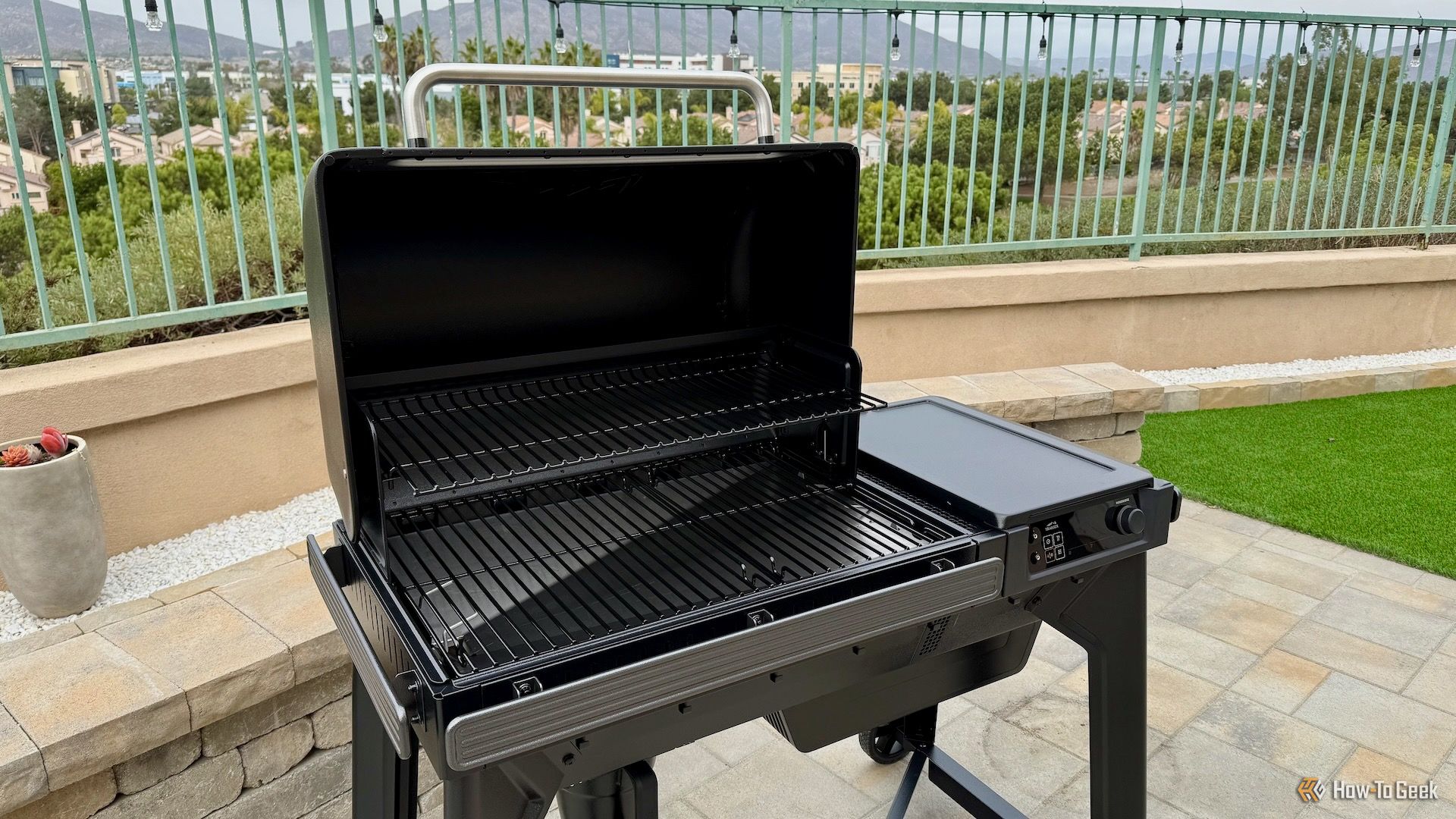 Traeger Woodridge with the lid open looking at the grates.