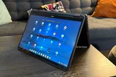 The Acer Chromebook Plus Spin 514 in tent mode on a table.