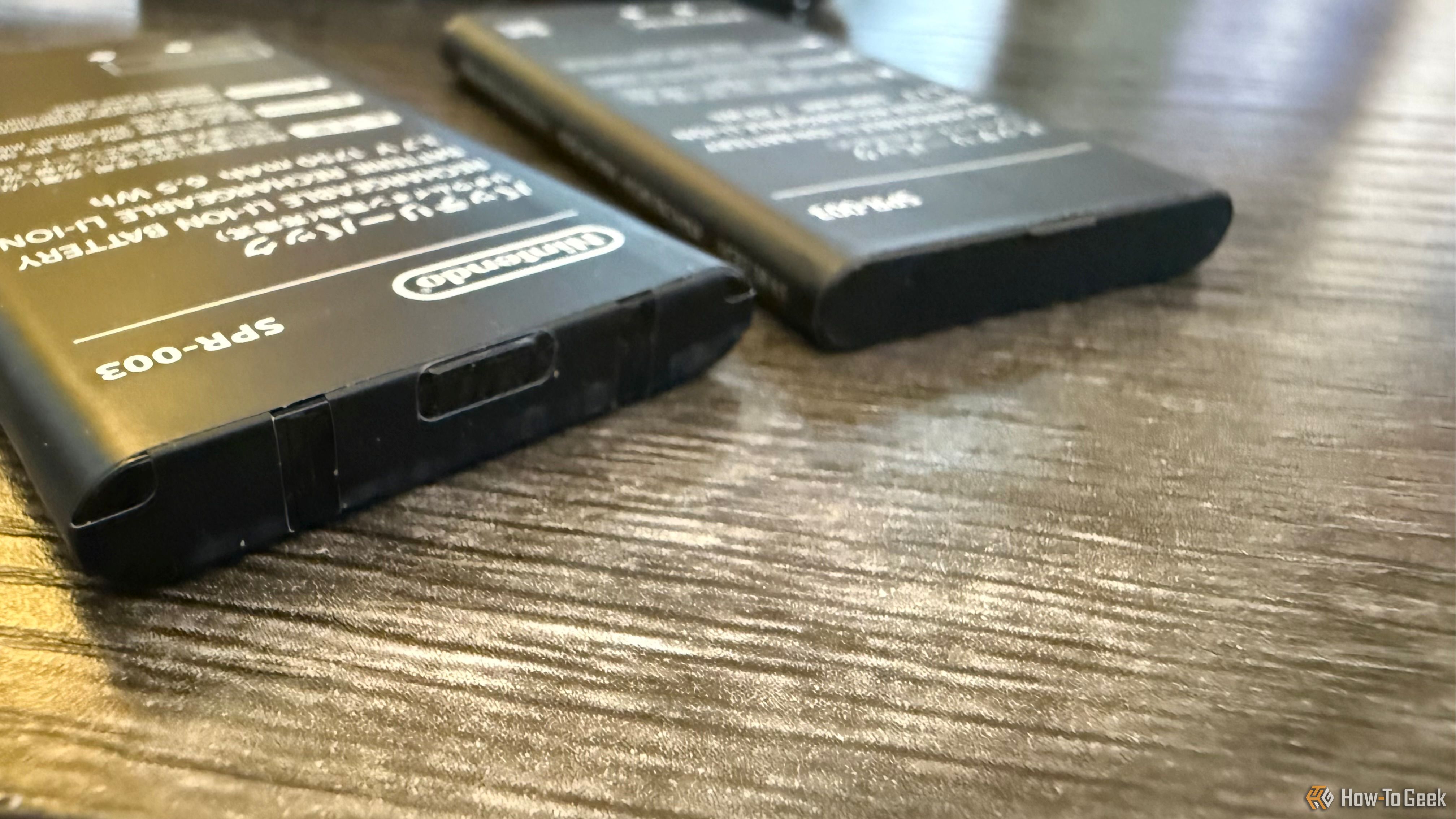 Nintendo 3DS batteries on a table.