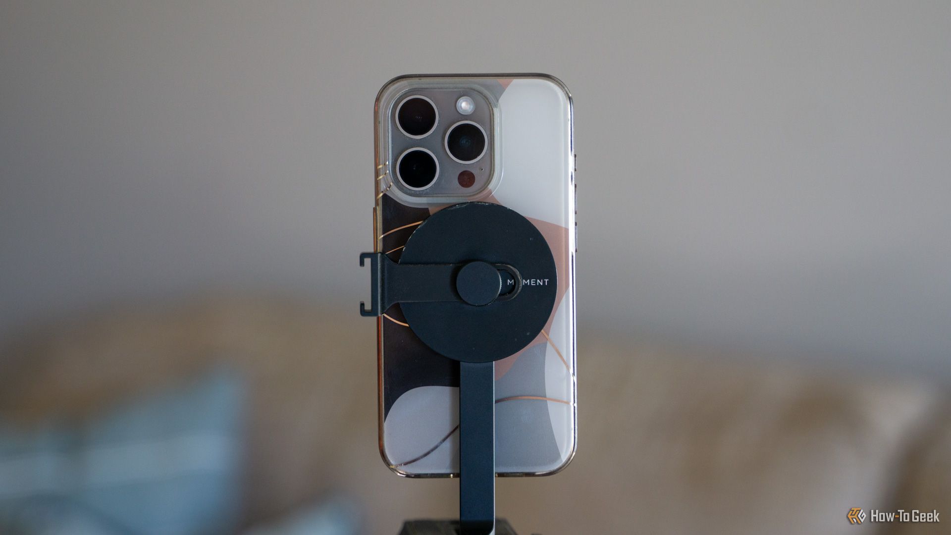 An iPhone with a MagSafe case mounted to the Moment MagSafe tripod mount.