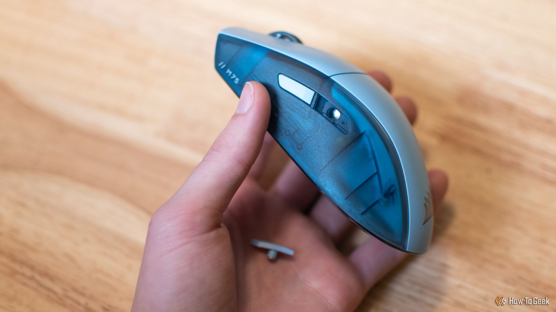 Removing the side buttons from the M75 Wireless Mouse.