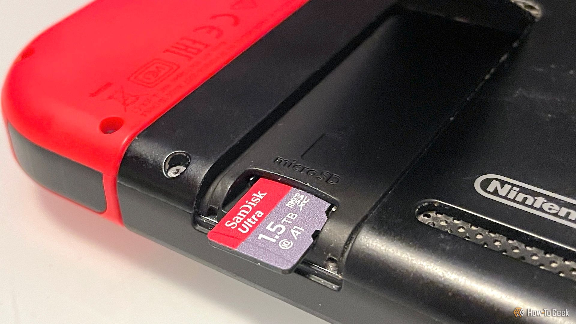 Inserting a microSD card into a Nintendo Switch console.