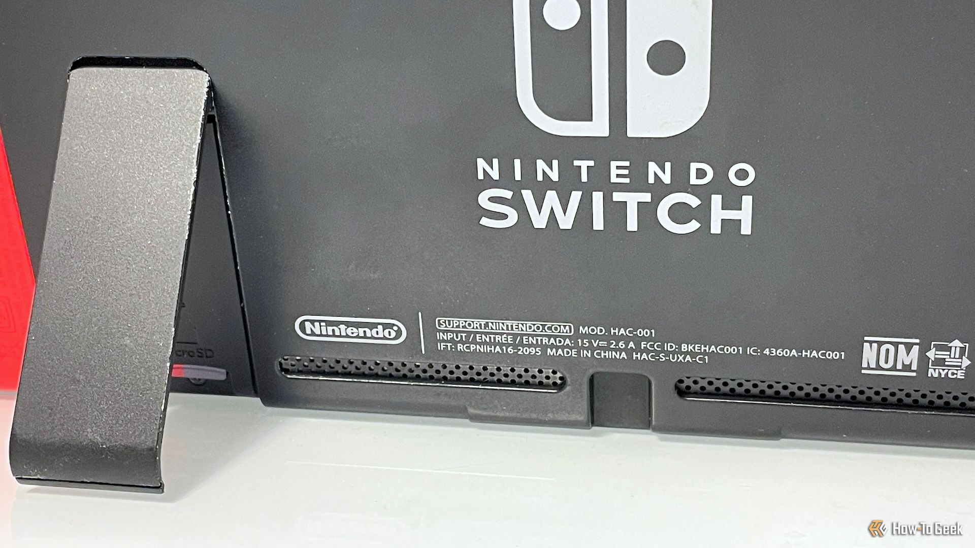 Back of a Switch console, propped up to keep the air intakes open.