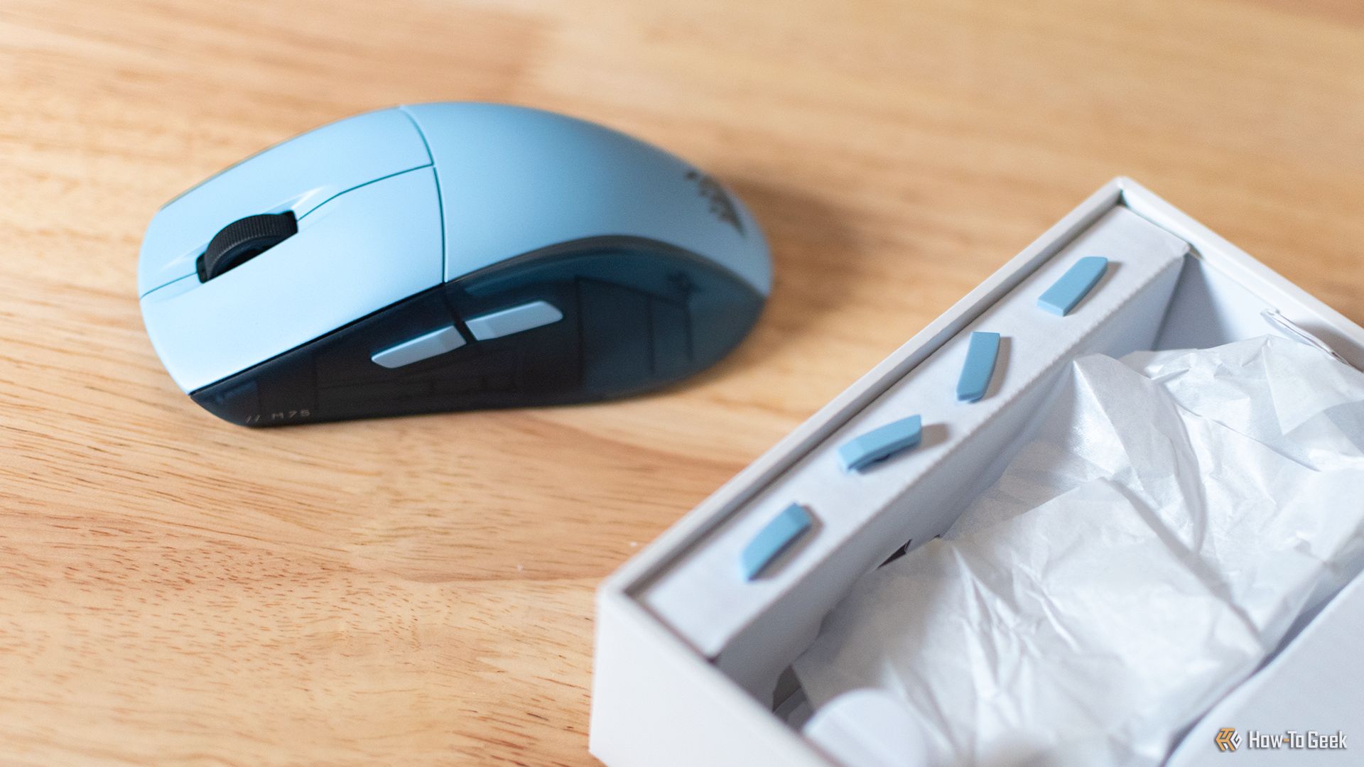 The Corsair M75 Wireless Mouse with its swappable side buttons.