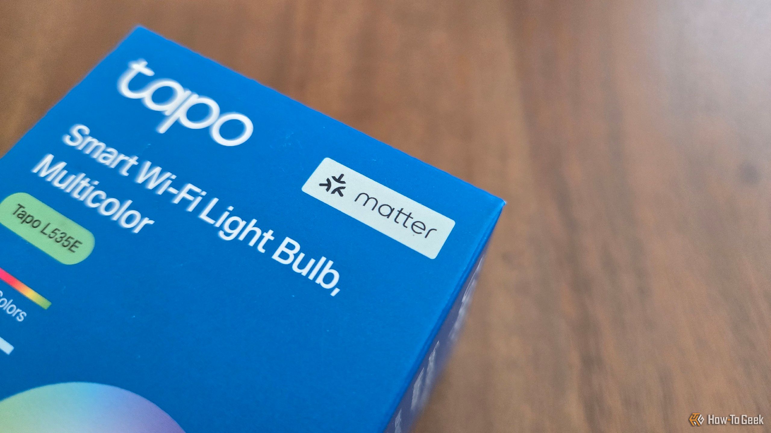 A Matter-compatible TP-Link Tapo smart bulb still in the box.