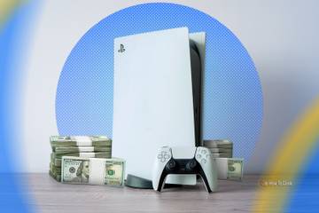 A PlayStation 5 with a stack of money beside it.