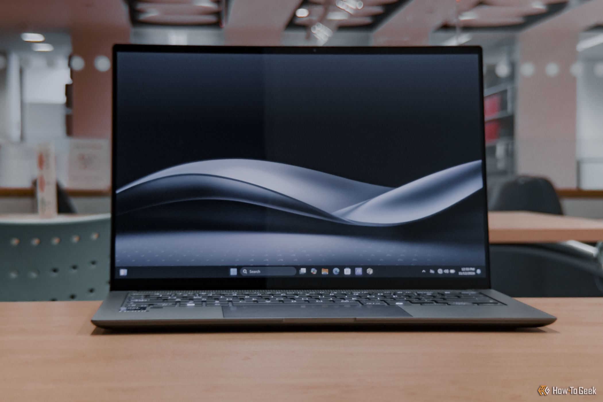 ASUS Zenbook S 14 screen with wallpaper on, closeup.