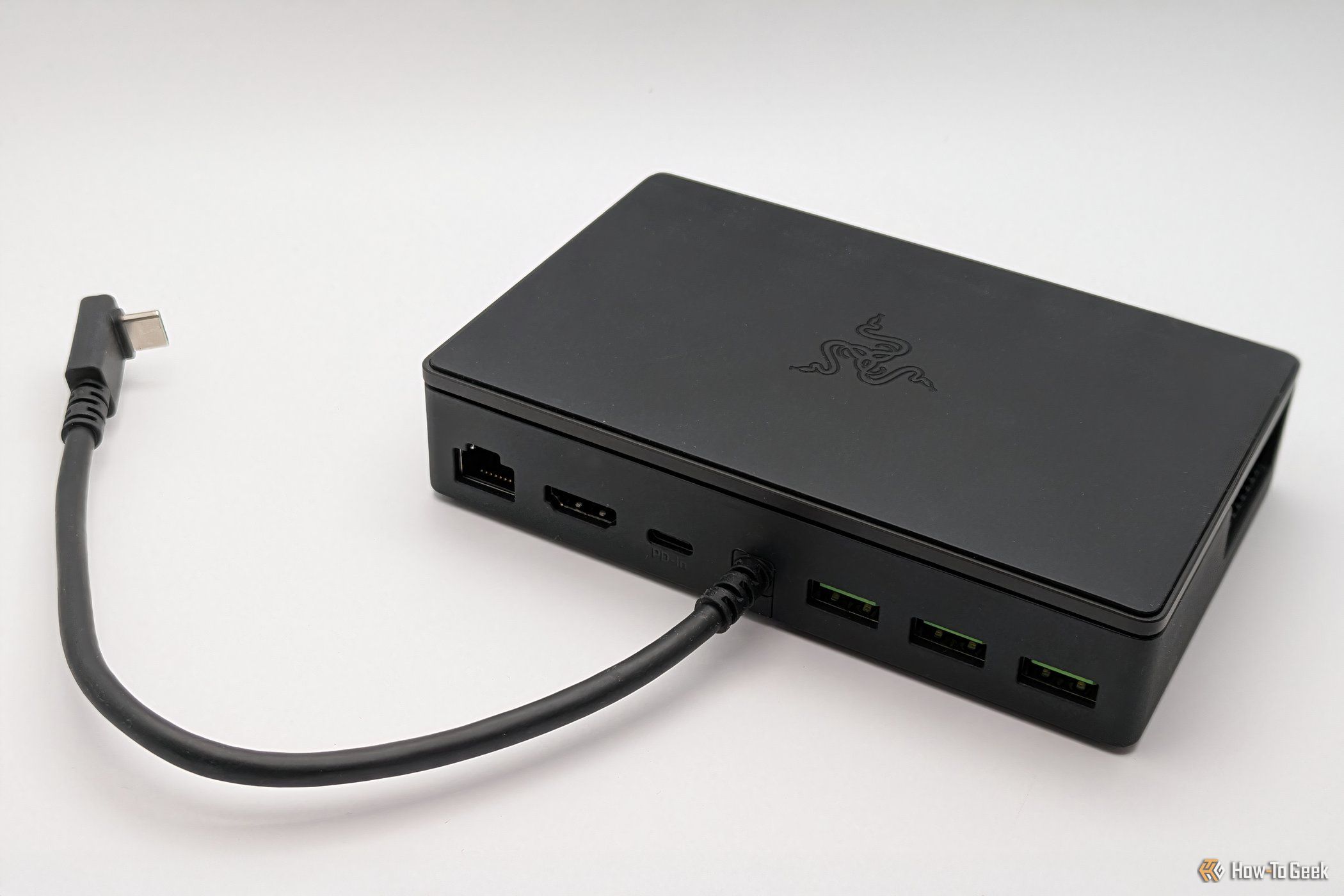 Razer Handheld Dock Chroma folded flat, showing back view with ports and attached USB-C cord