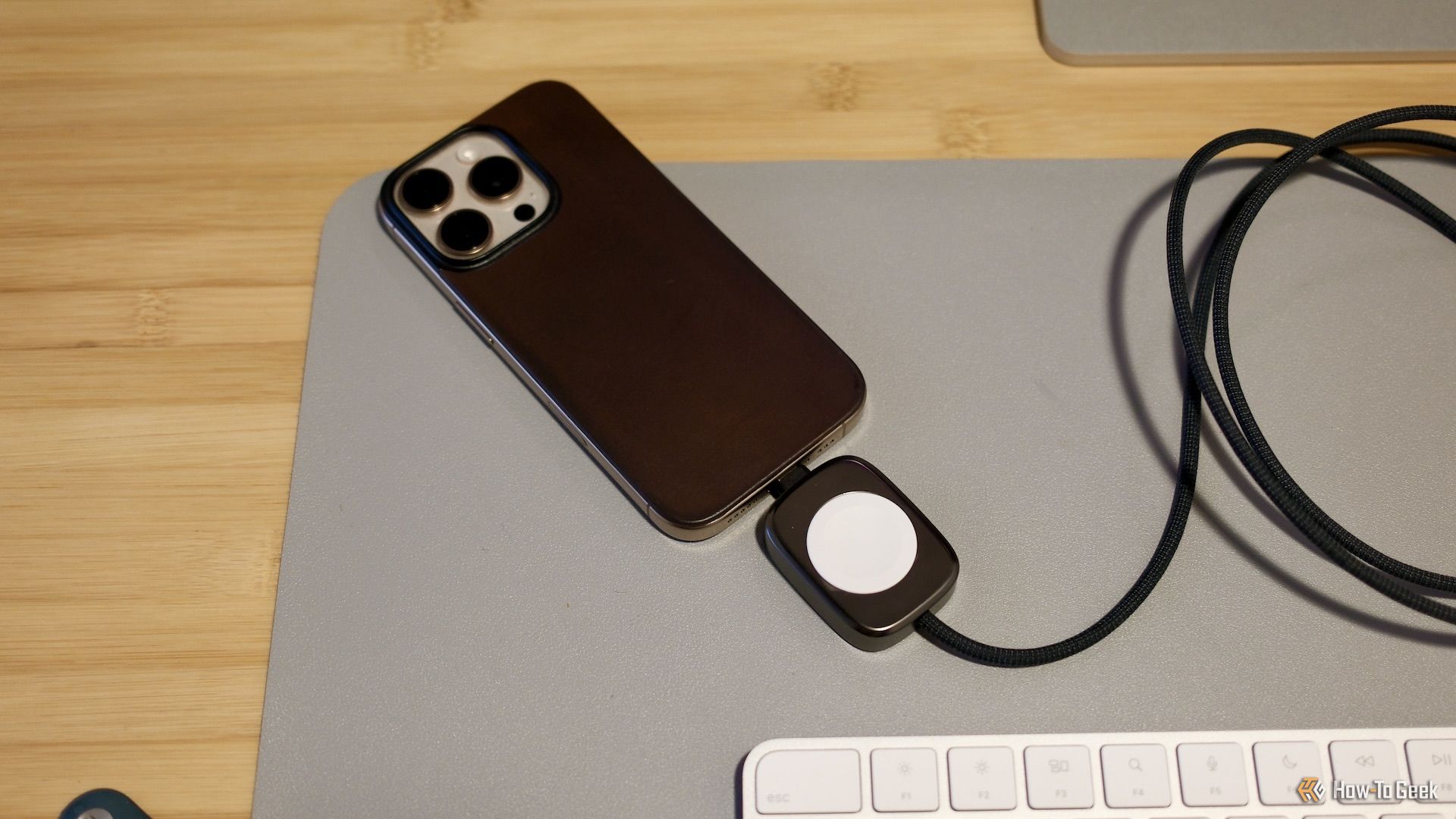 The Nomad hybrid Apple Watch and USB-C charger on a desk.