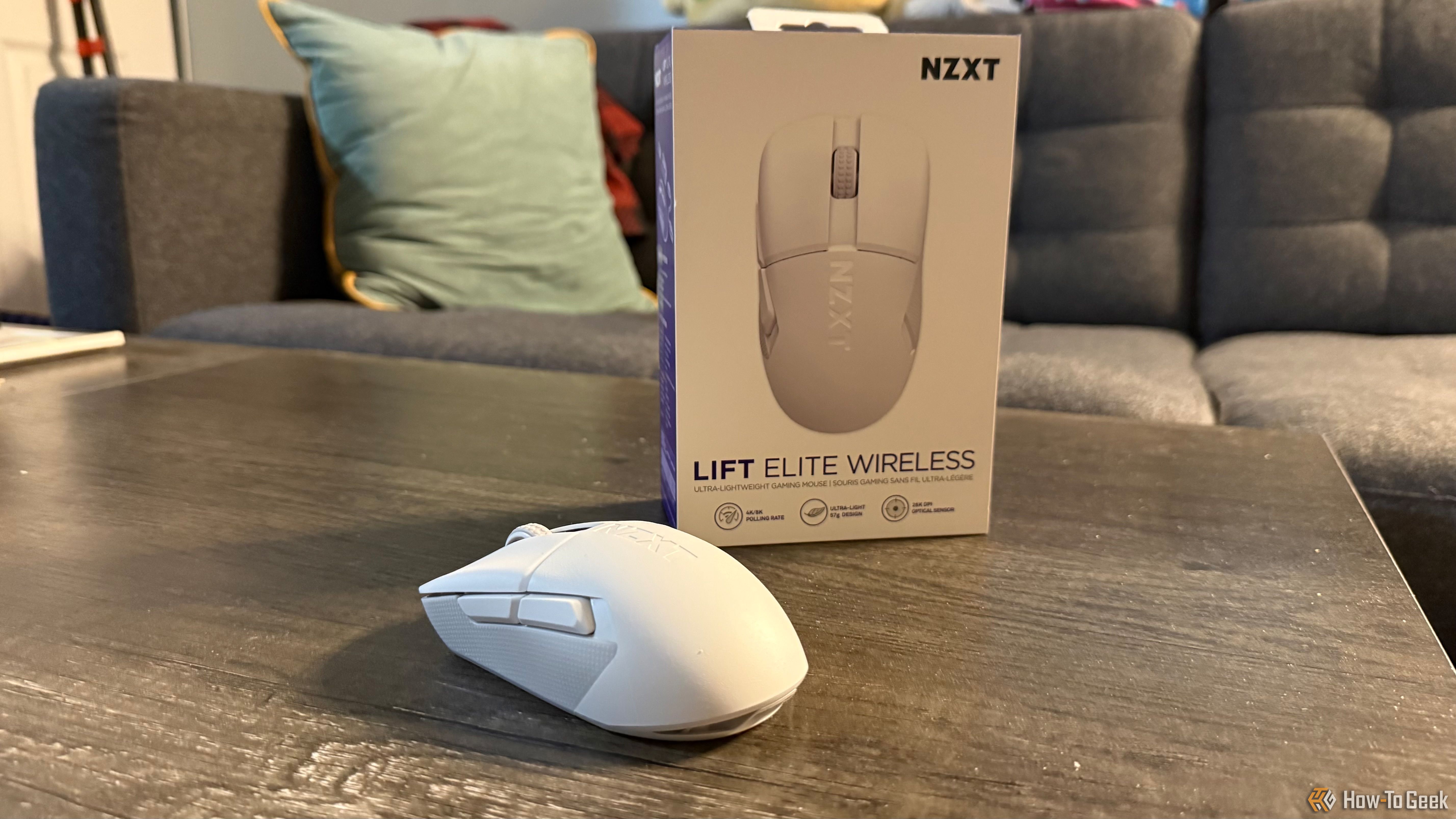 The matte white NZXT Lift Elite Wireless and its box.