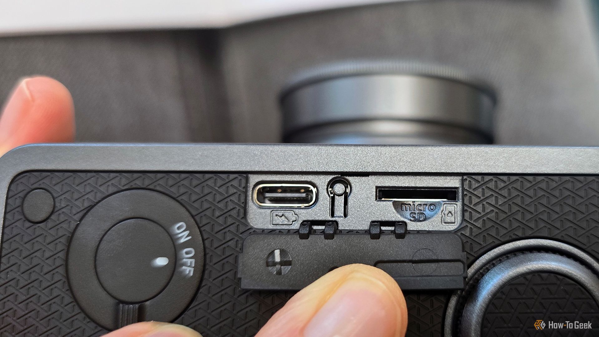 The USB-C port, reset button, and microSD card port on the Instax Wide Evo hybrid camera.