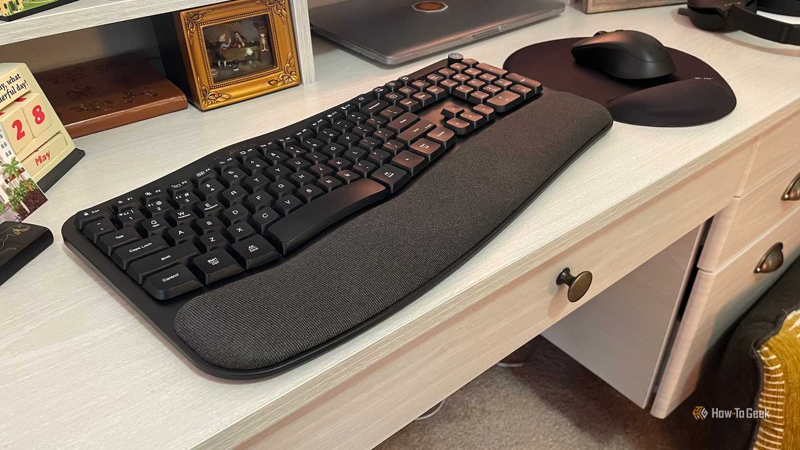 An angled view of the JLab Flow Mouse and Keyboard on a desk.