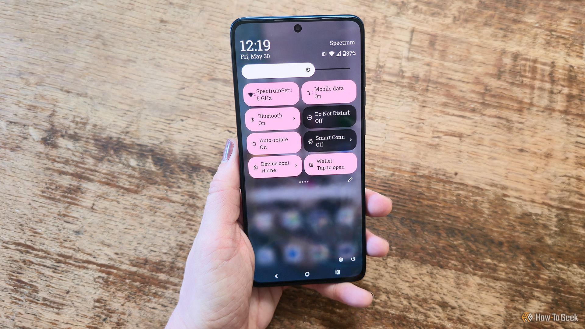 Someone holding the Motorola Moto G Stylus (2025) phone on its quick panel page.