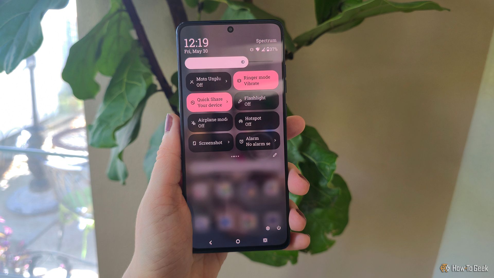 Someone holding the Motorola Moto G Stylus (2025) phone on its quick panel page.
