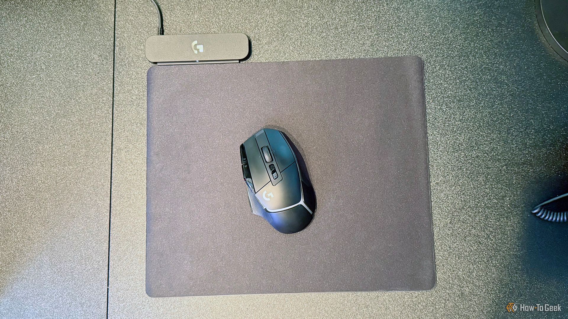Logitech G502 X Plus Lightspeed mouse on the Logitech G Powerplay 2 Wireless Charging System.
