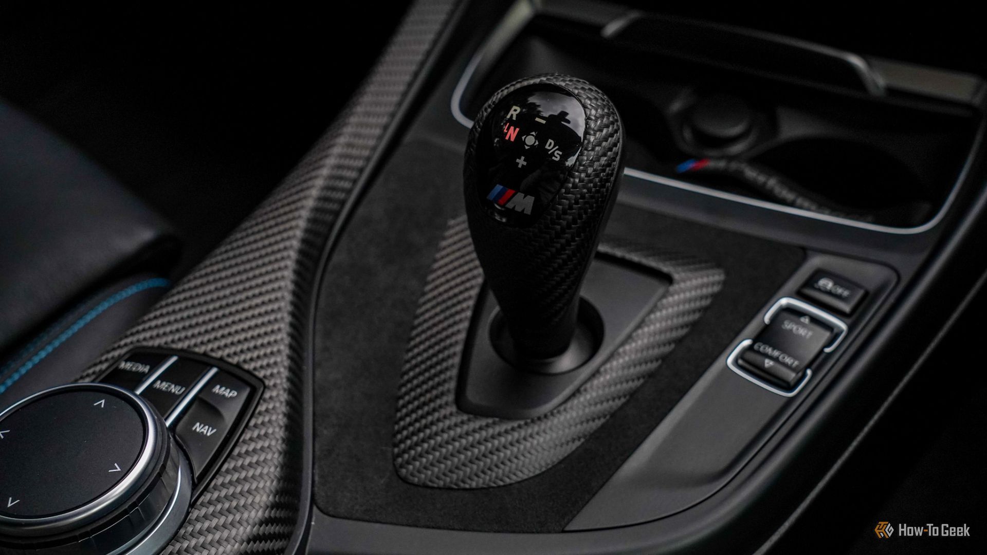 Close-up shot of the DCT gear selector in a 2018 BMW M2.