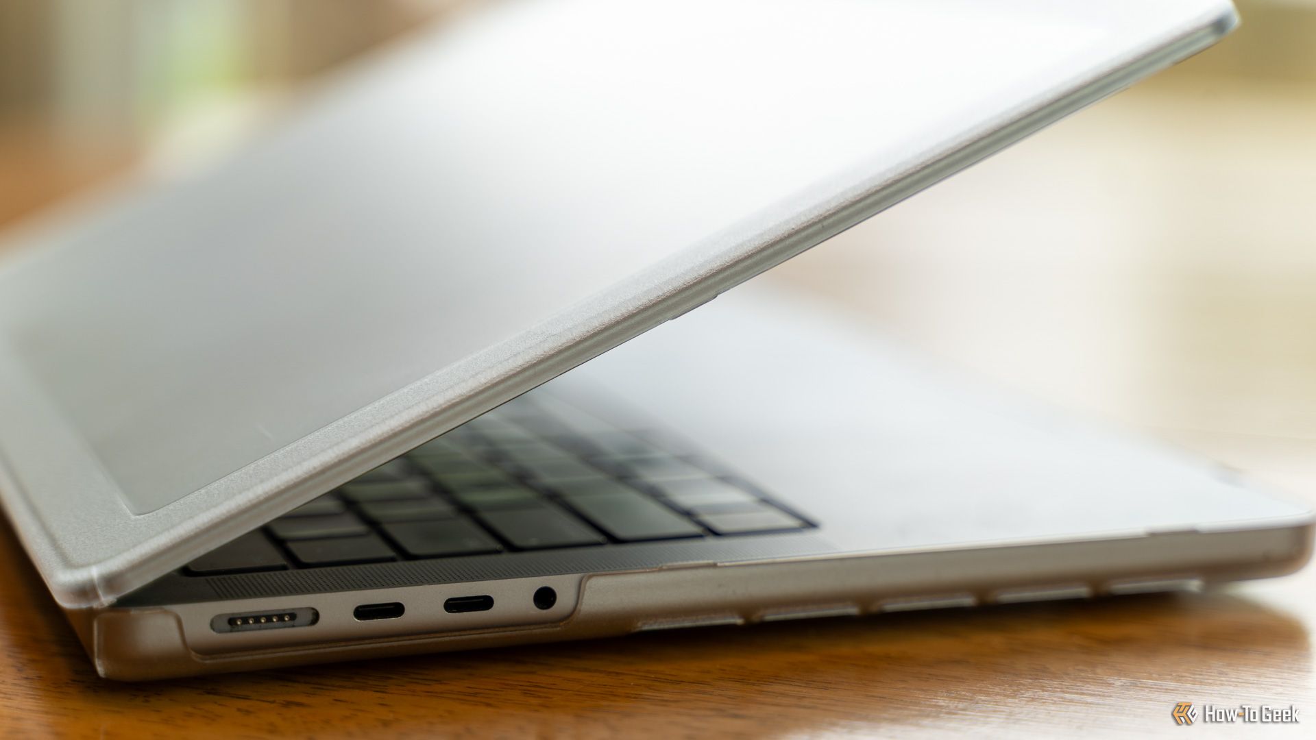 A MacBook Pro 14-inch M1 Max in the Incase Edge Hardshell Case with USB-C ports and MagSafe showing.