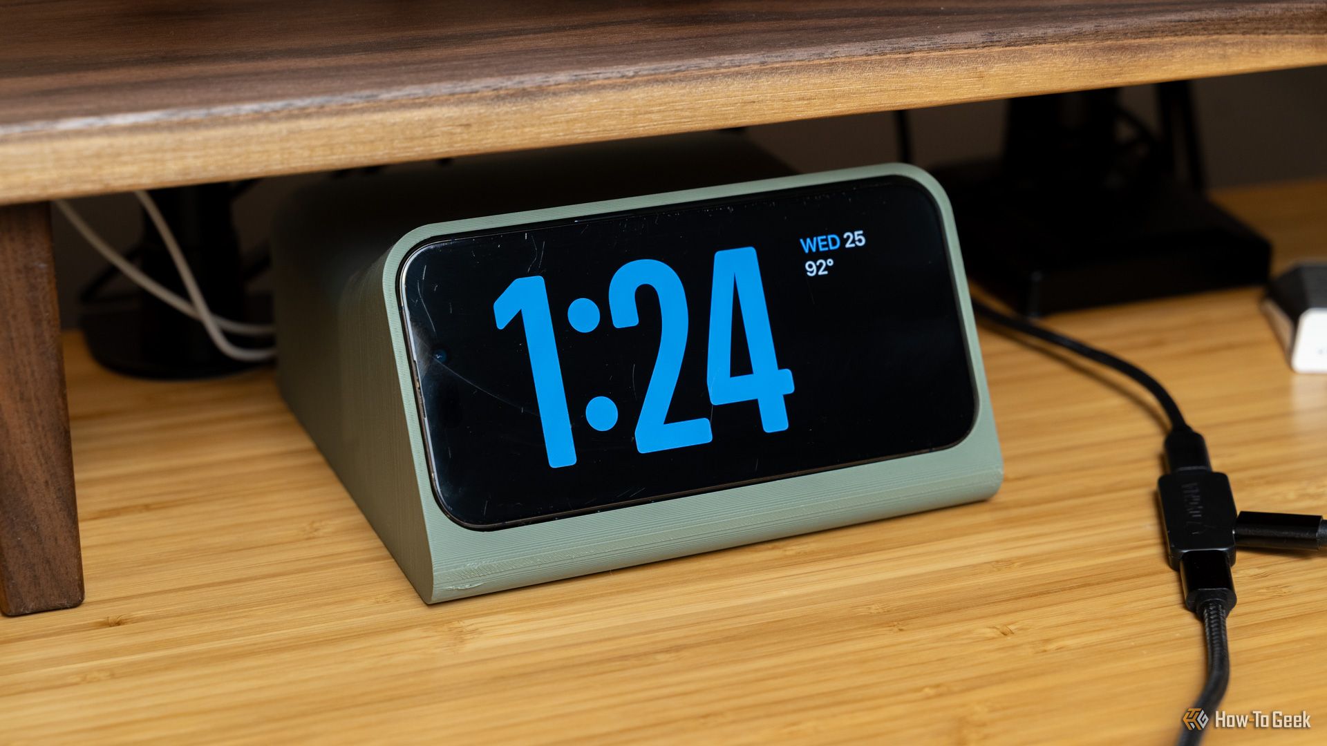 A 3D printed MagSafe dock that holds an iPhone in the position for Standby mode.