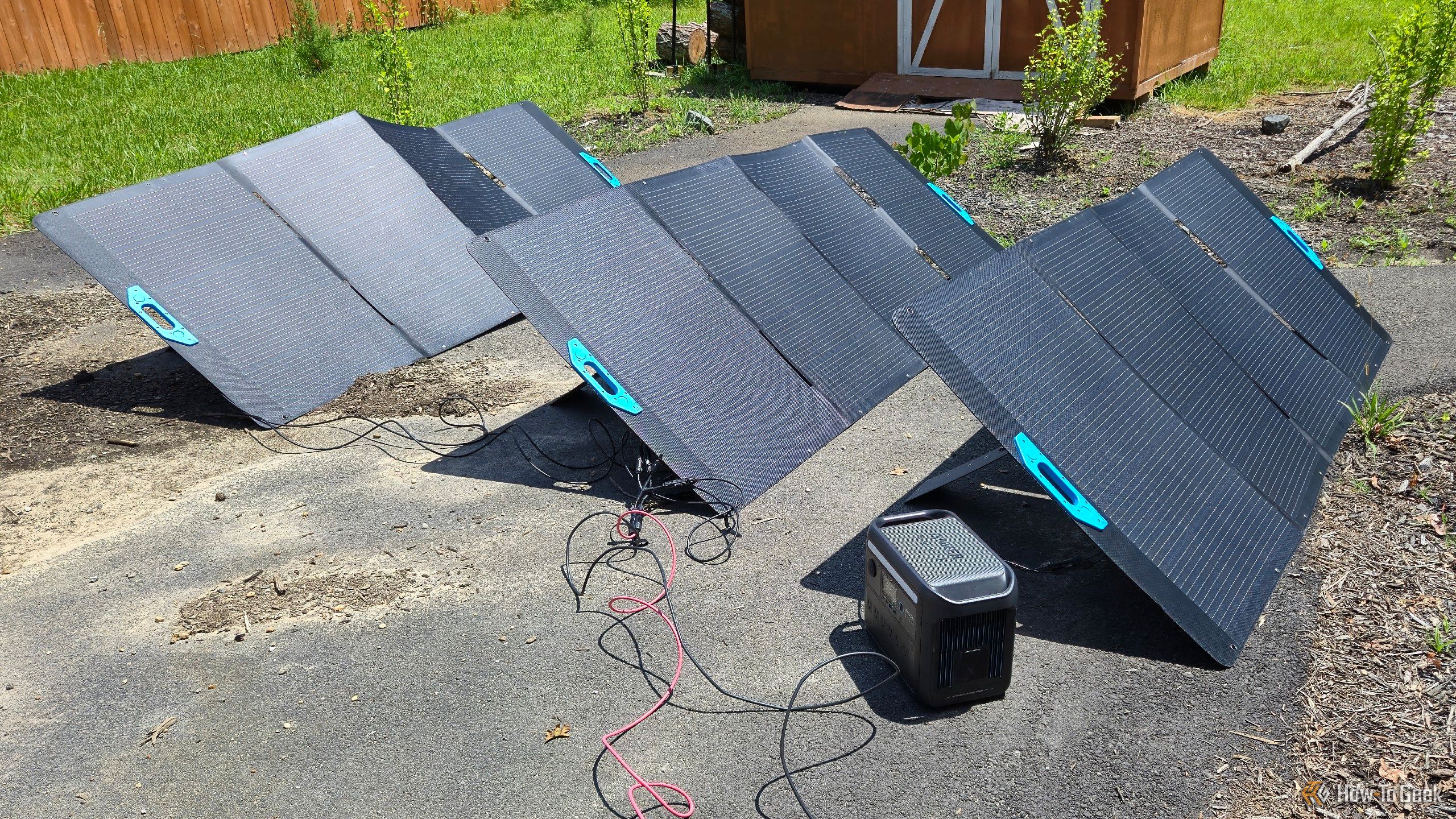 Four Anker Solix PS400 portable solar panels charging devices.