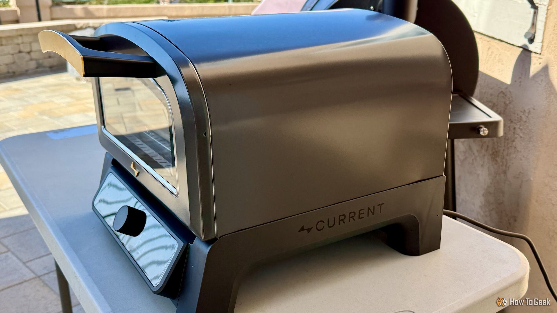 Current model P outside the cooking of a pizza.