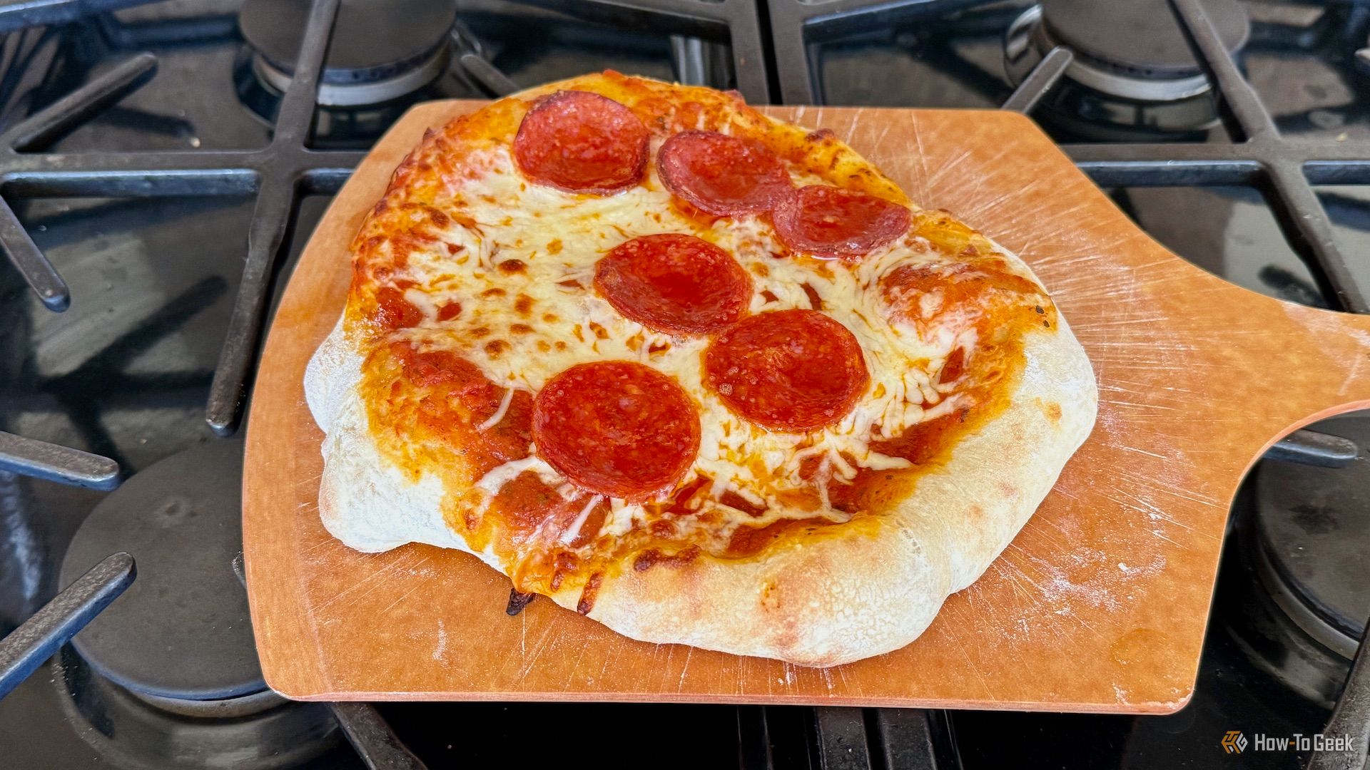 Pizza on a board made in the current model P.