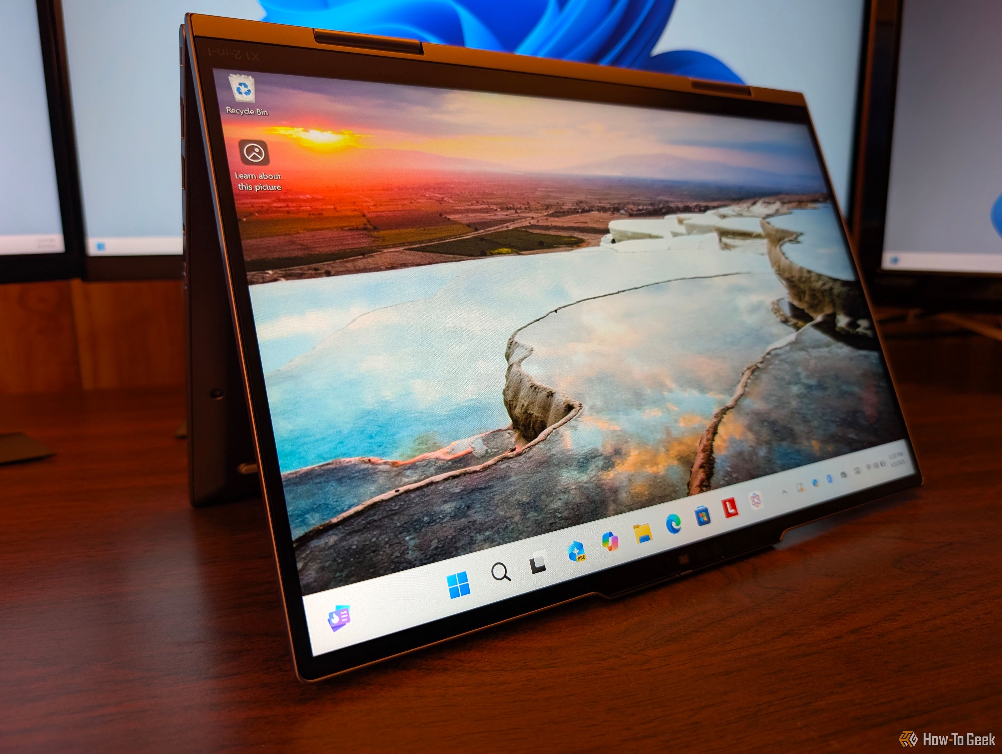 The laptop folded into an A shape and placed on a desk. 