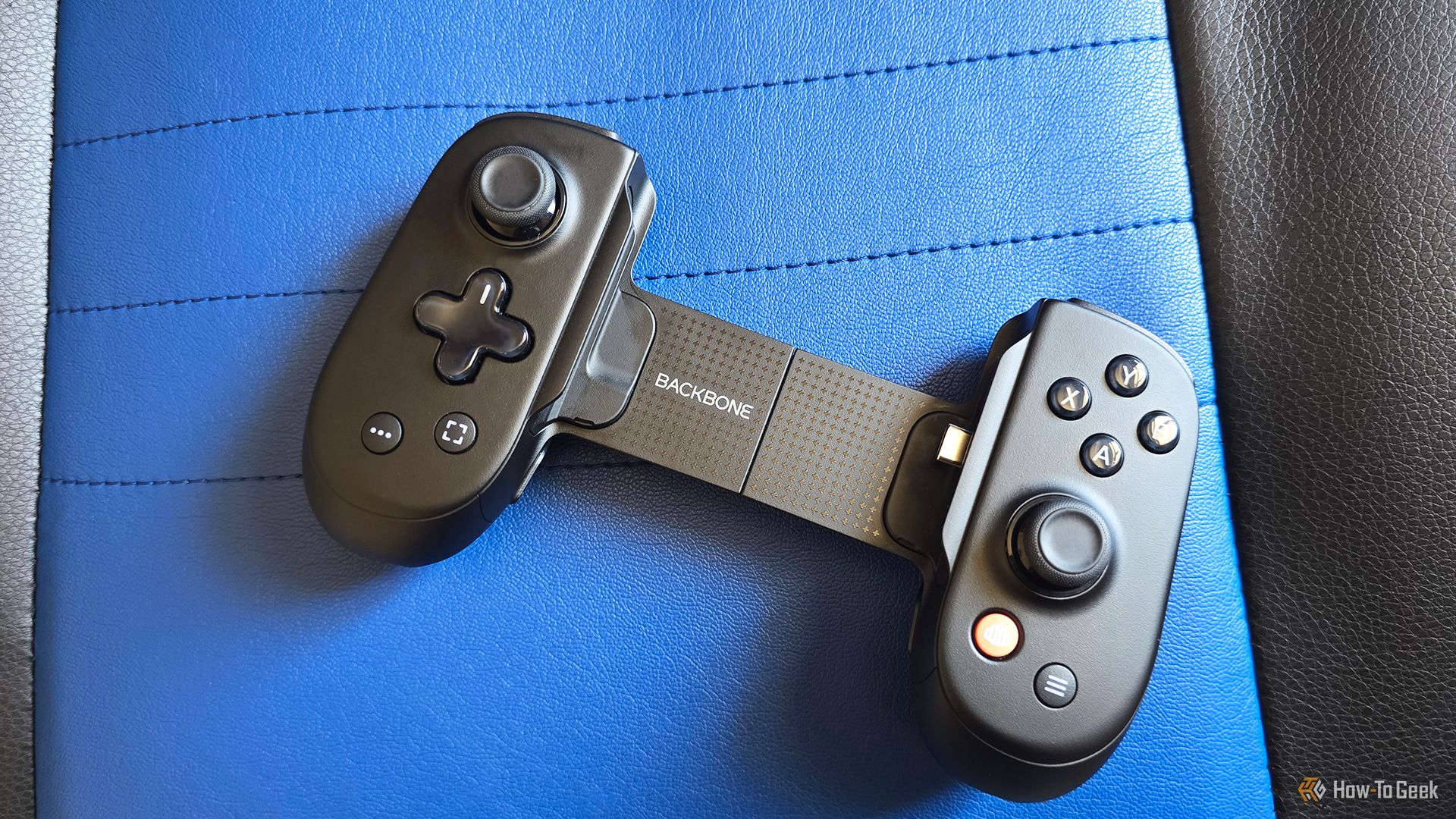 The Backbone Pro controller on a gaming chair.