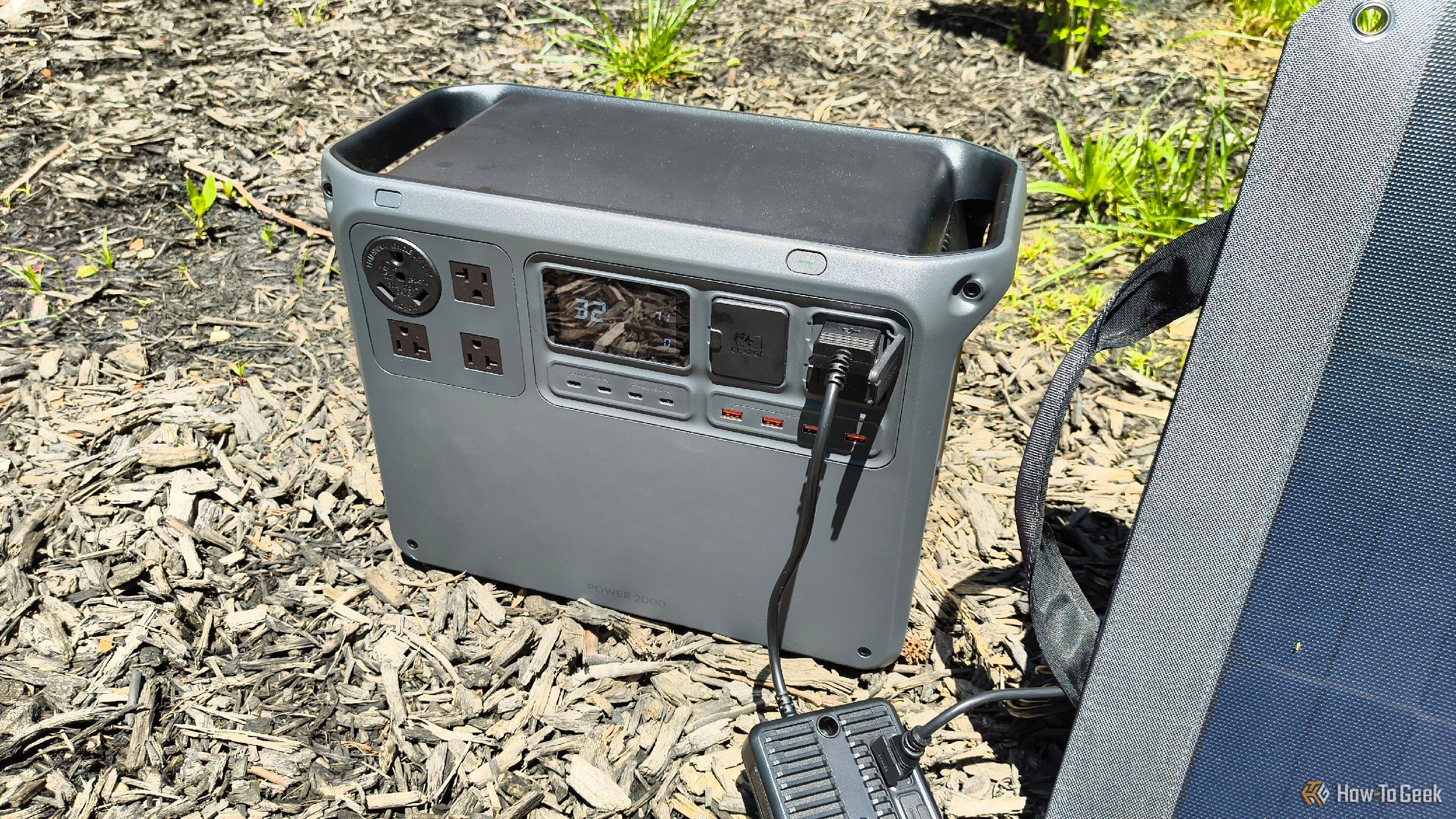 The front of a DJI Power 2000 portable power station while charging.
