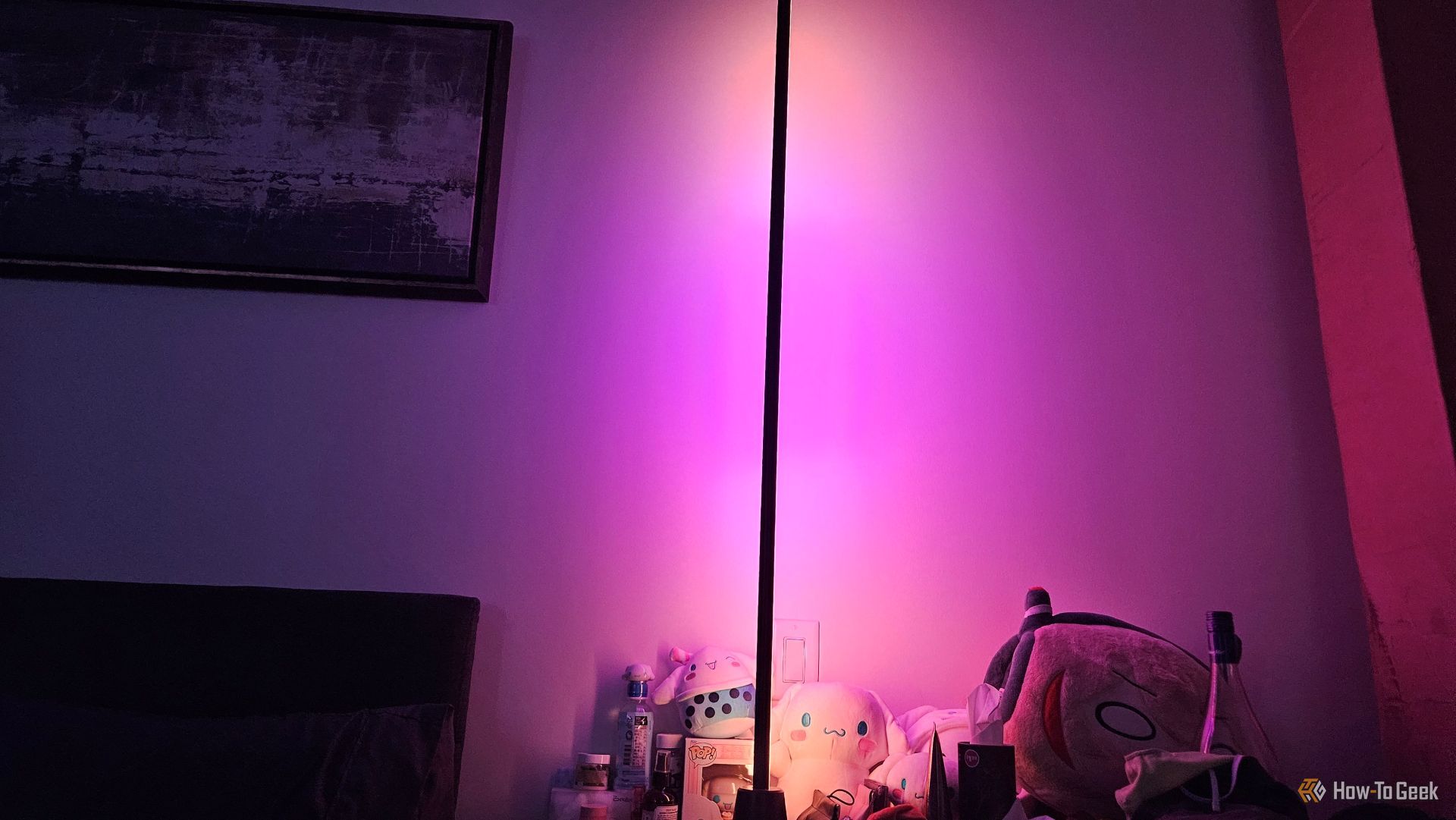 The WiZ gradient floor light illuminating a wall.