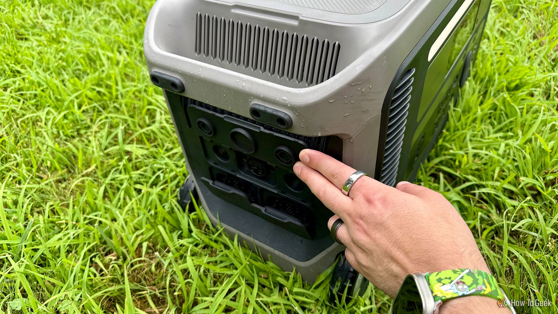 Hand opening port cover on Anker SOLIX F3000 Portable Power Station.