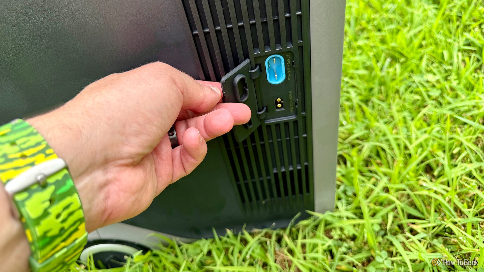 Opening solar power port cover on the Anker SOLIX F3000 Portable Power Station.