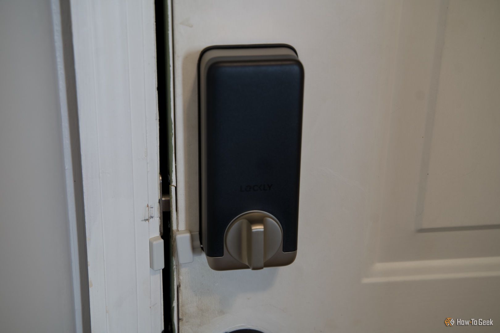 The inside portion of the Lockly Visage smart lock showing the door sensor.
