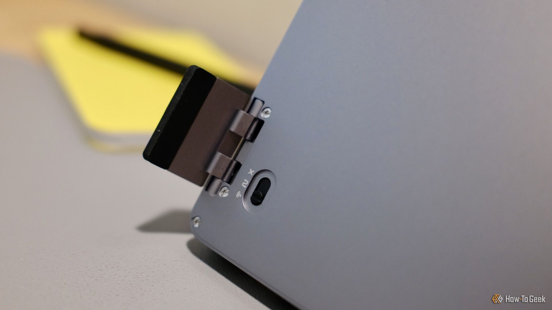 A close up of the foot and connection switch underneath the Lofree Flow 2.
