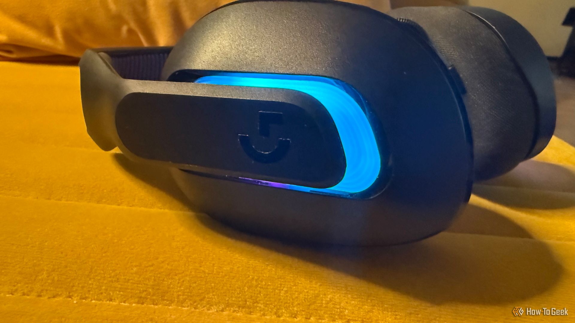 Blue and purple RGB lighting on the side of the Logitech G522 Lightspeed gaming headset.