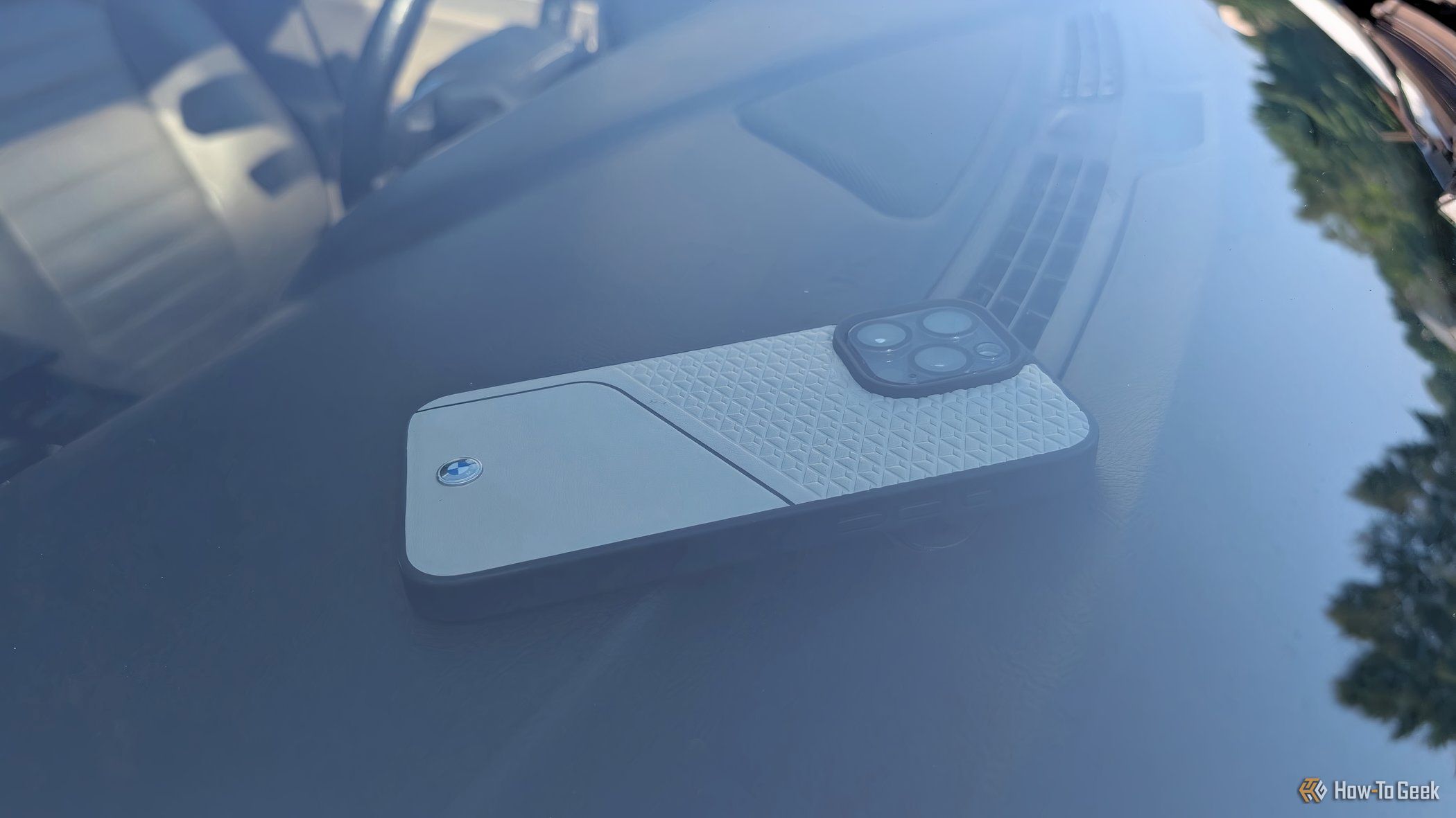 An iPhone on a car dashboard.
