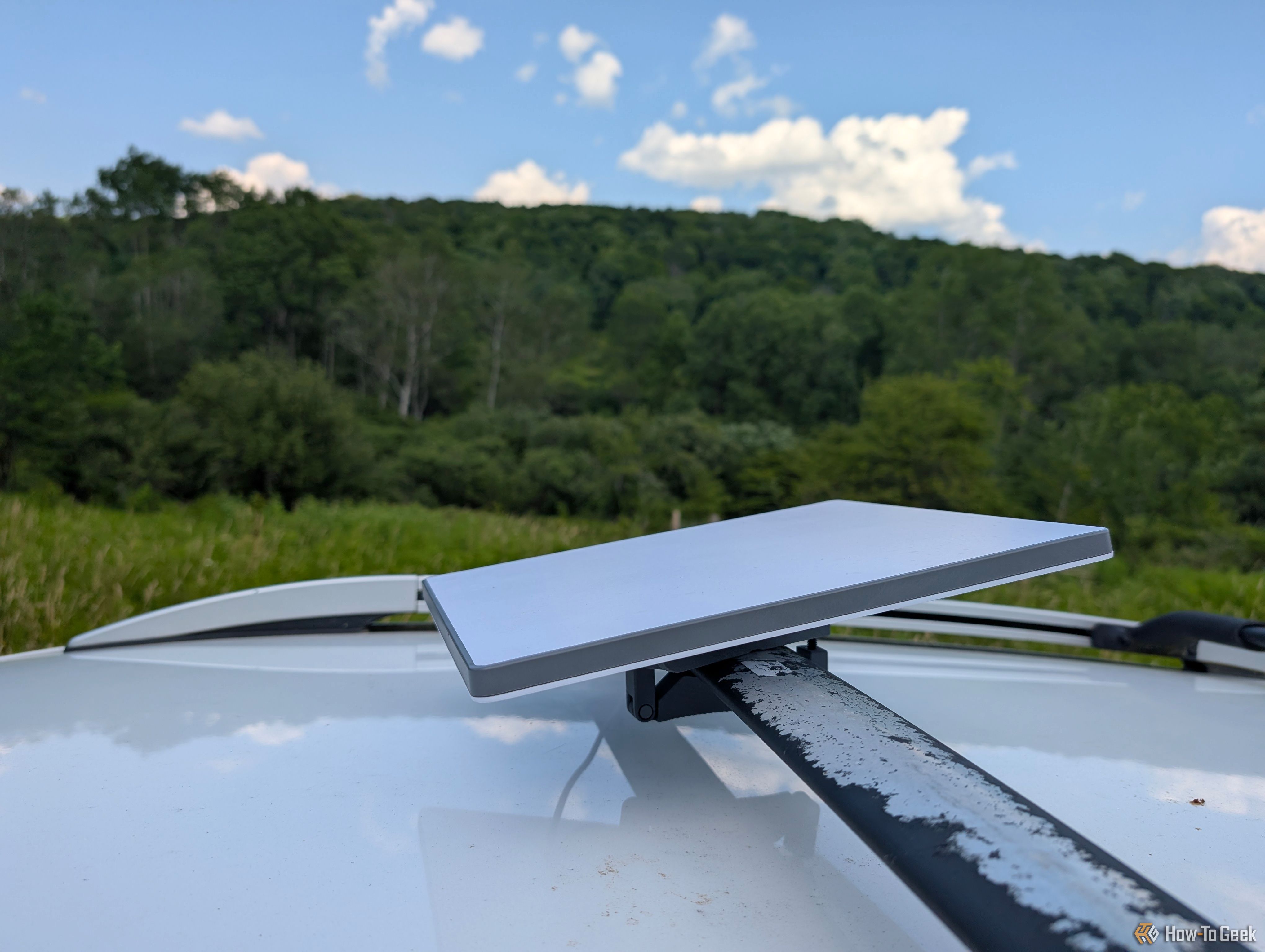 The Starlink Mini on top of a car. 