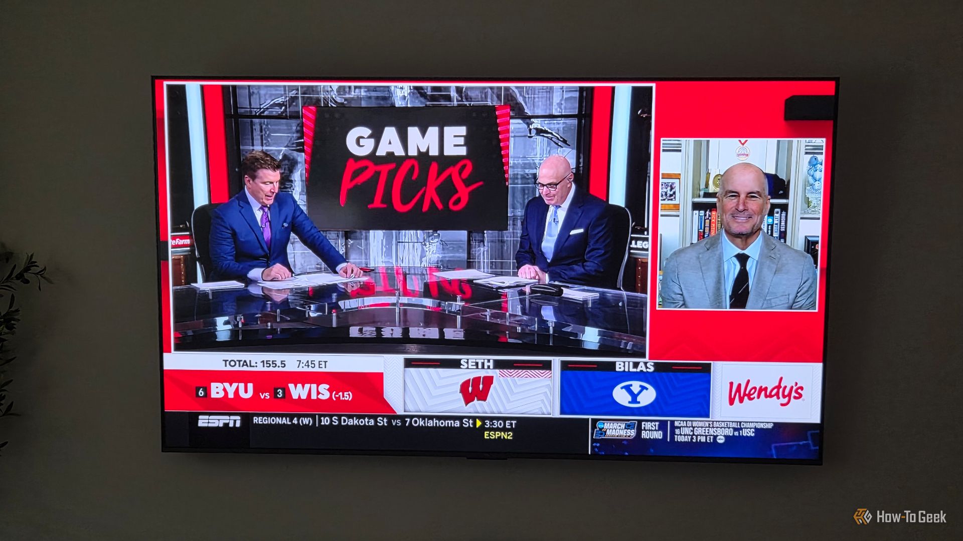 TCL QM6K TV with sports on the screen. 